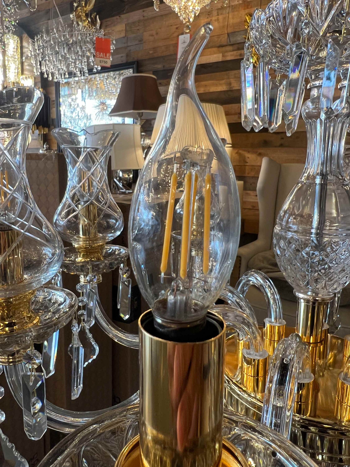 Close-up of a crystal chandelier with visible light bulb