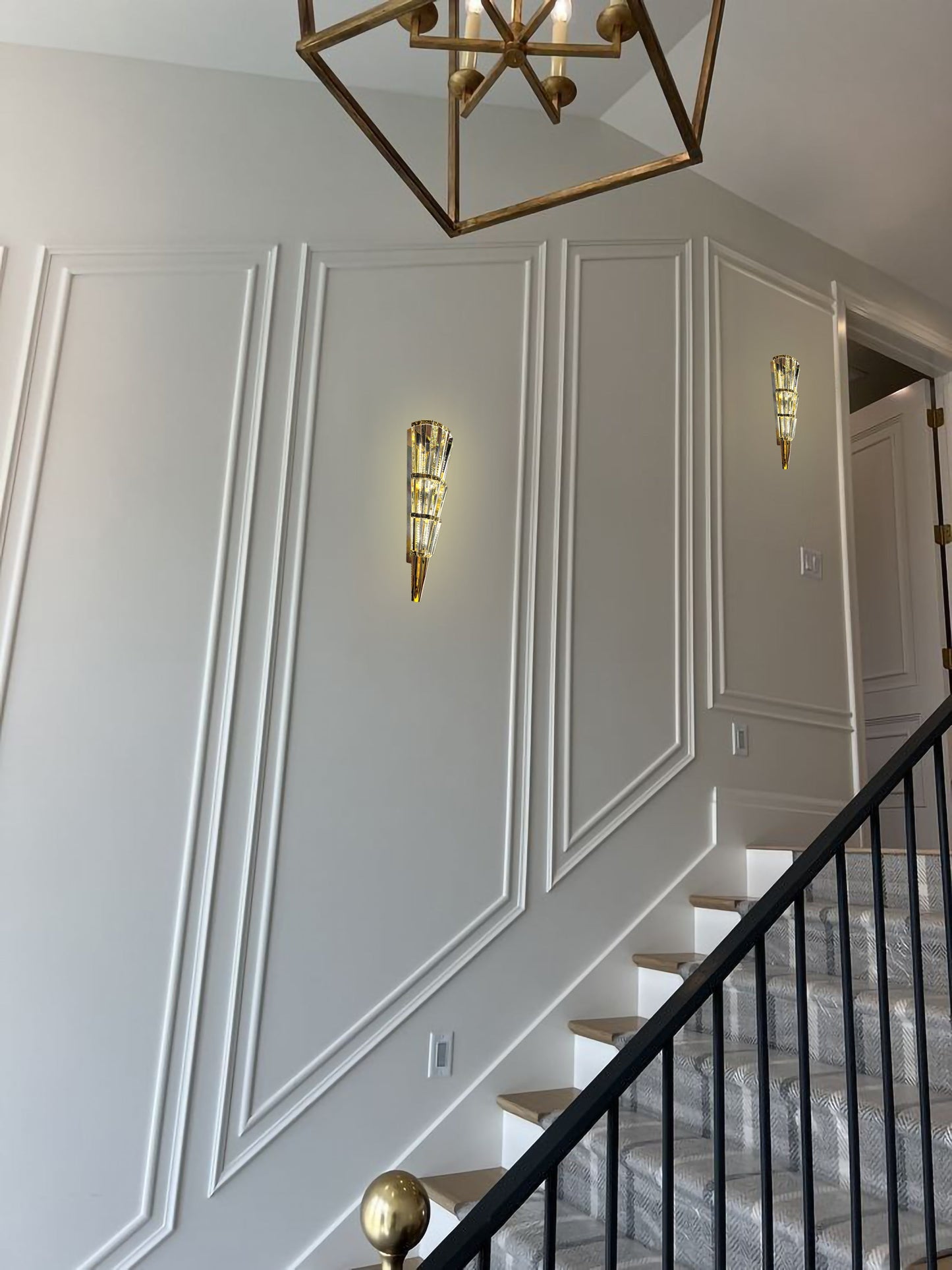 Gold crystal LED sconce installed in hallway
