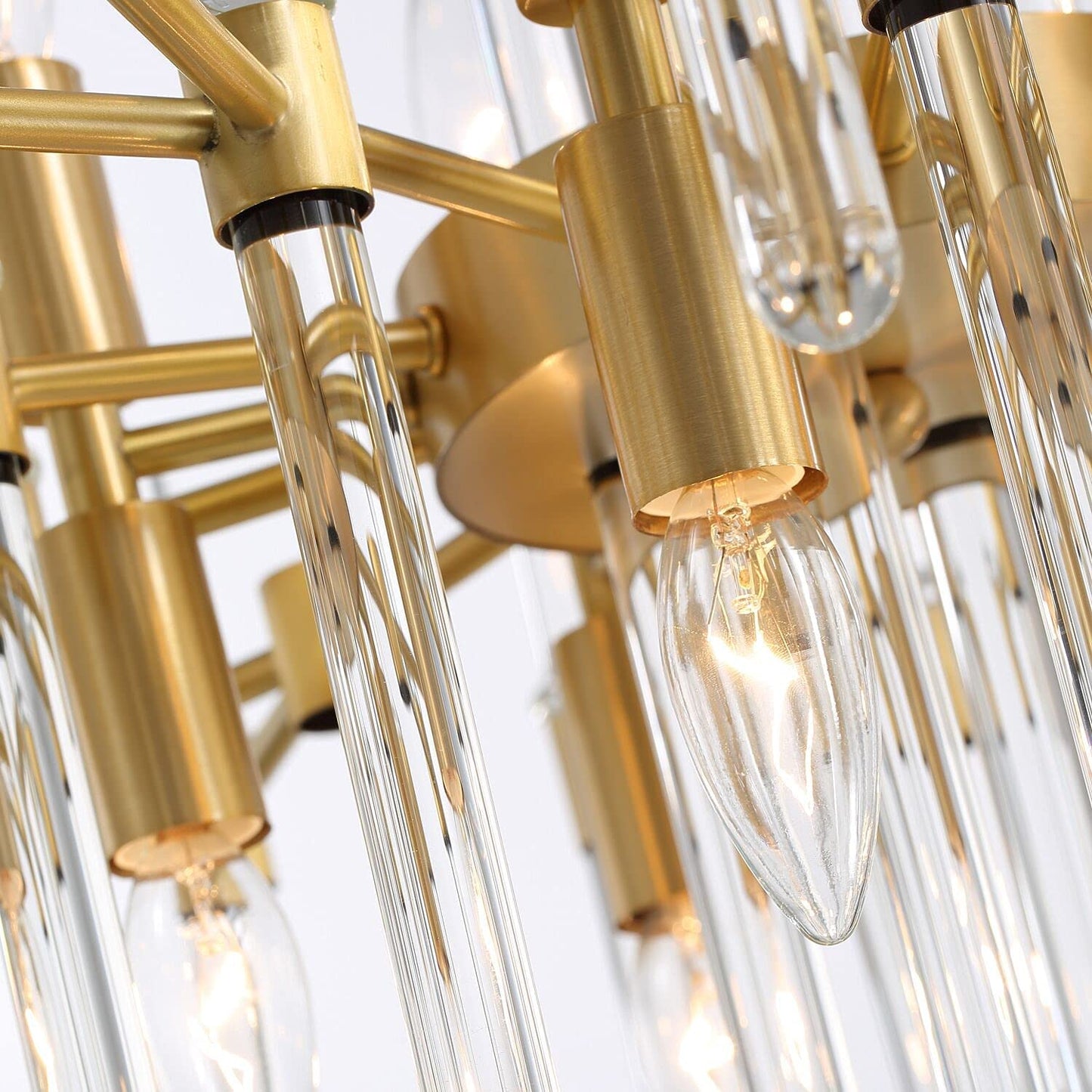 Modern brass chandelier showcasing vertical glass rod detailing