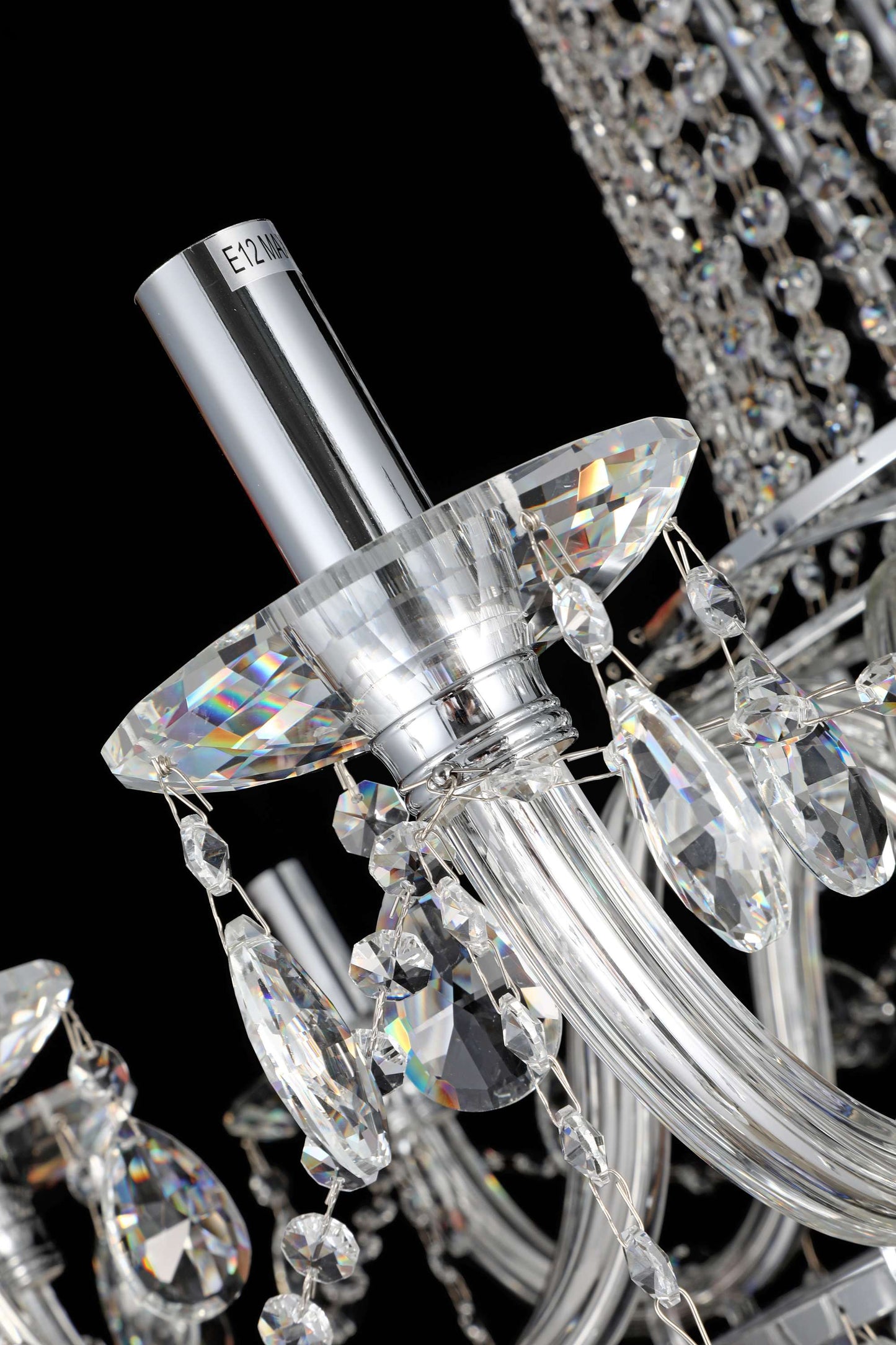 Detailed view of curved crystal arms and polished chrome frame for radiant reflection.