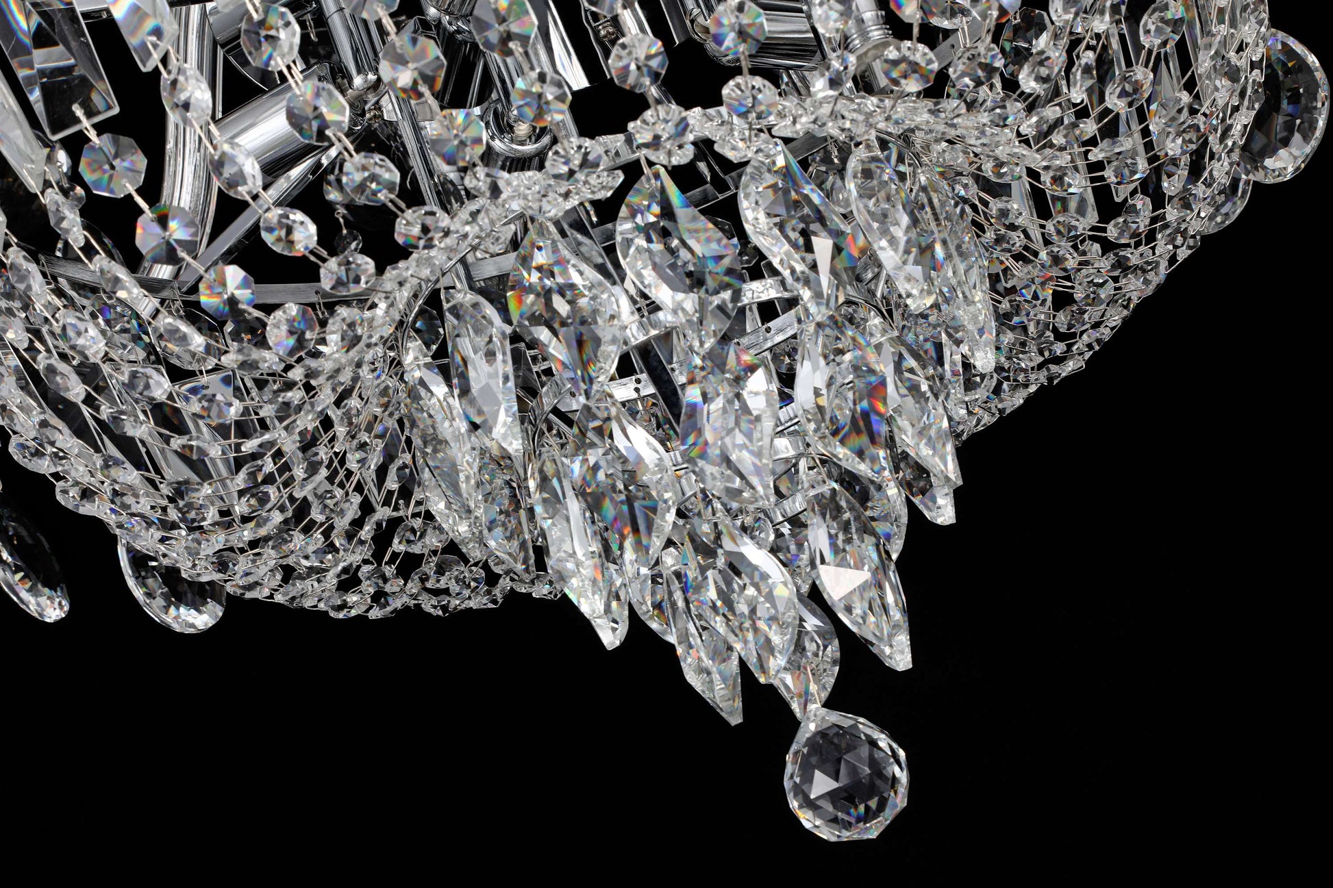 35 inch Close-up of chrome crystal chandelier featuring tiered crystal strands and reflective brilliance.