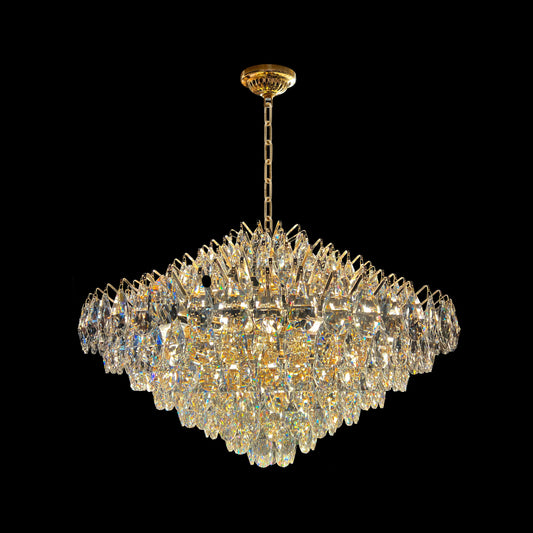Close-up of champagne gold crystal teardrop chandelier with empire-style design.
