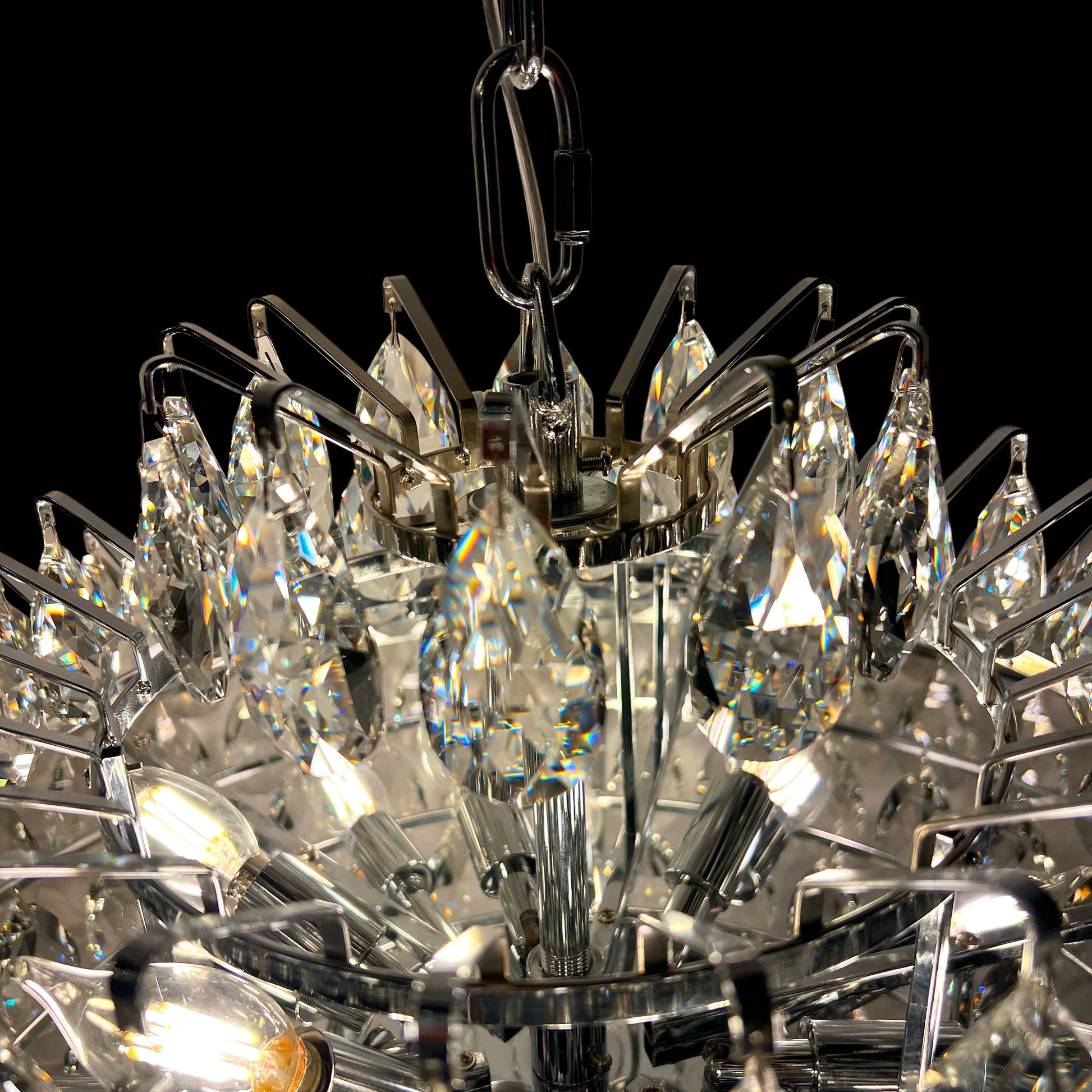 Detailed close-up of 31 inch chrome crystal chandelier showing stainless steel frame, tear drop crystals