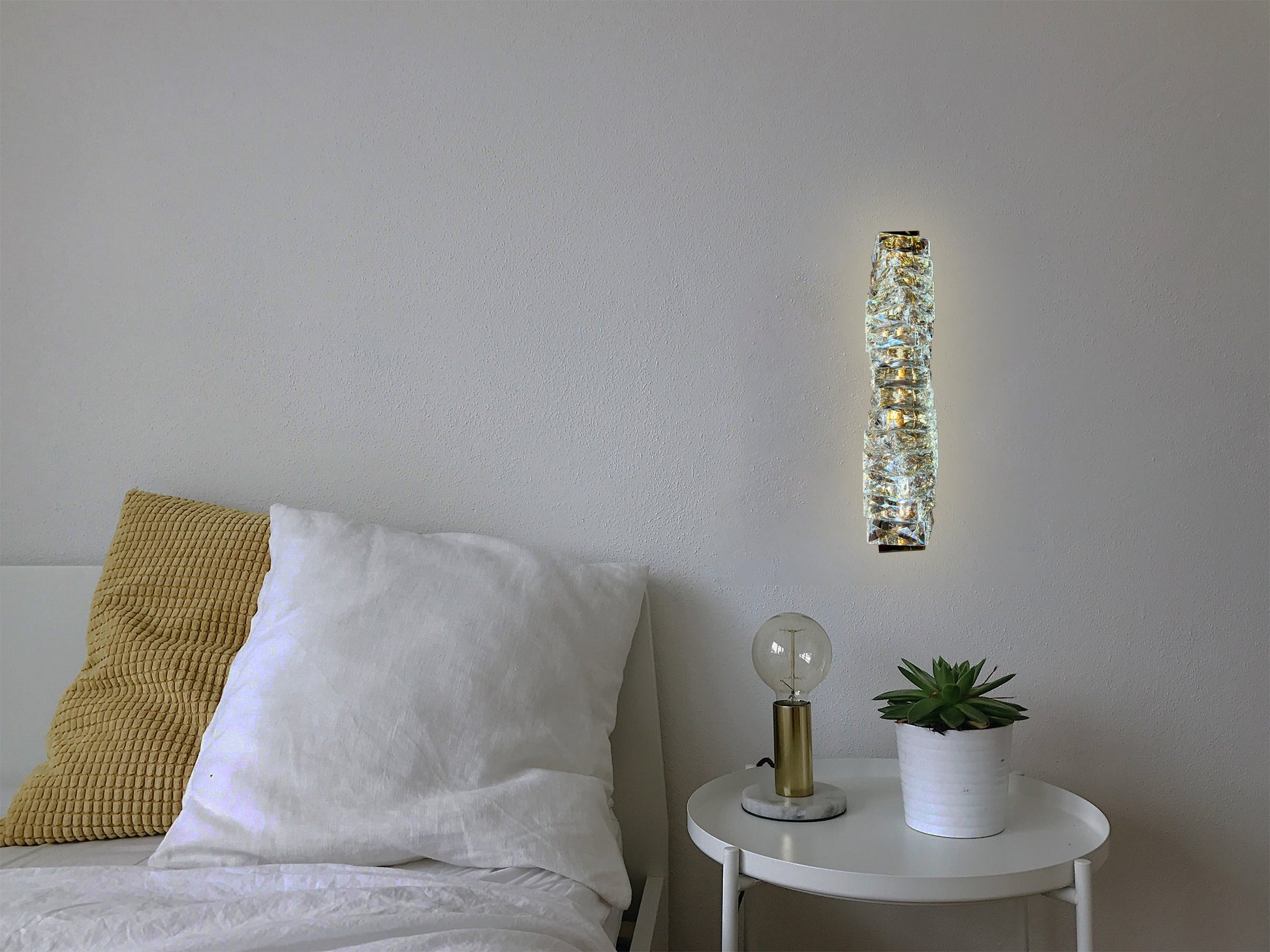 Crystal LED wall sconce styled in modern bedroom
