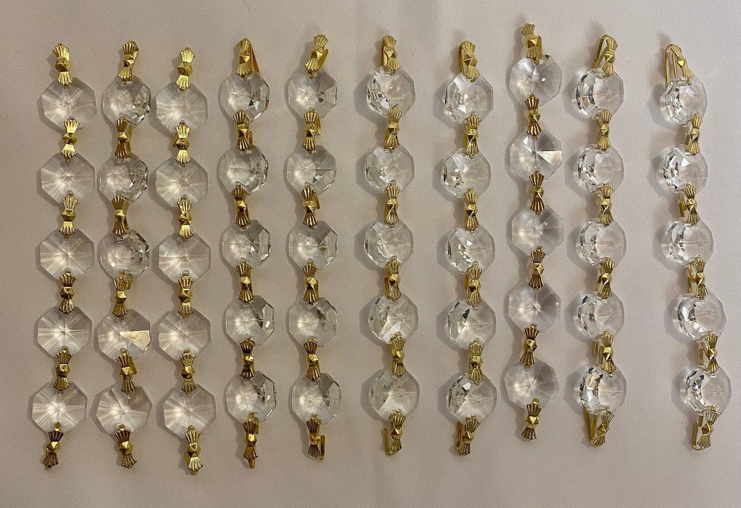 Luxury crystal chandelier strands flat lay detail