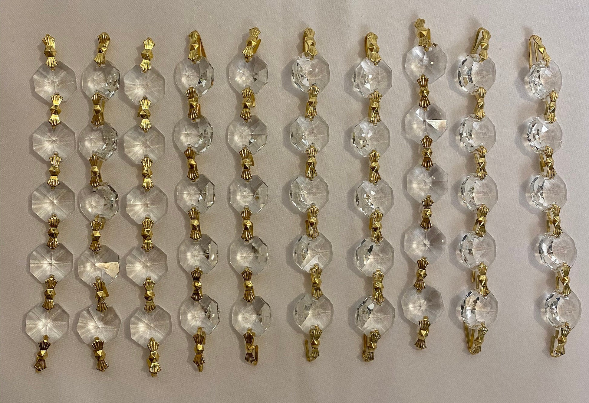 Luxury crystal chandelier strands flat lay detail