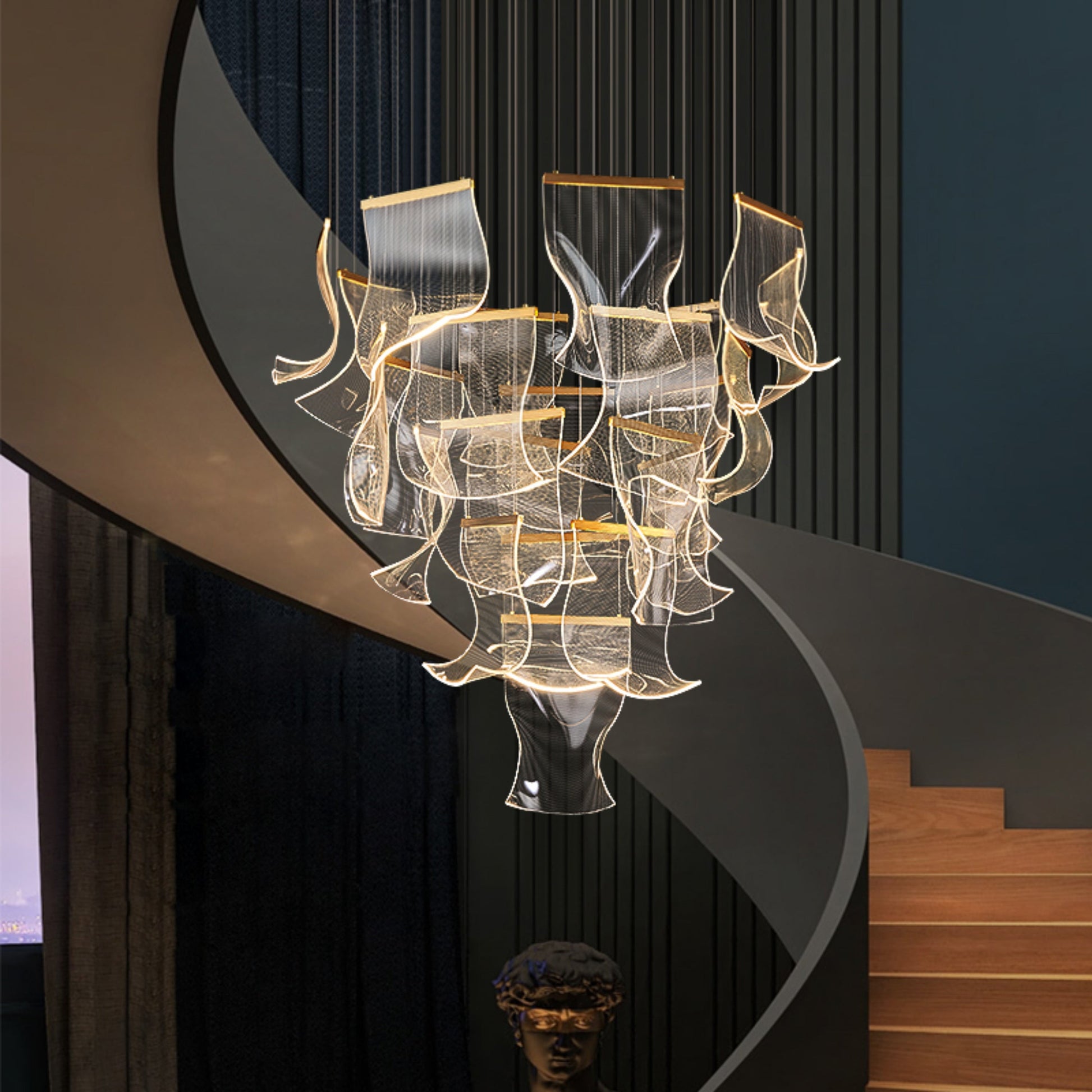  Close-up view of dimmable gold chandelier showing cascading acrylic wave panels and polished gold canopy design.
