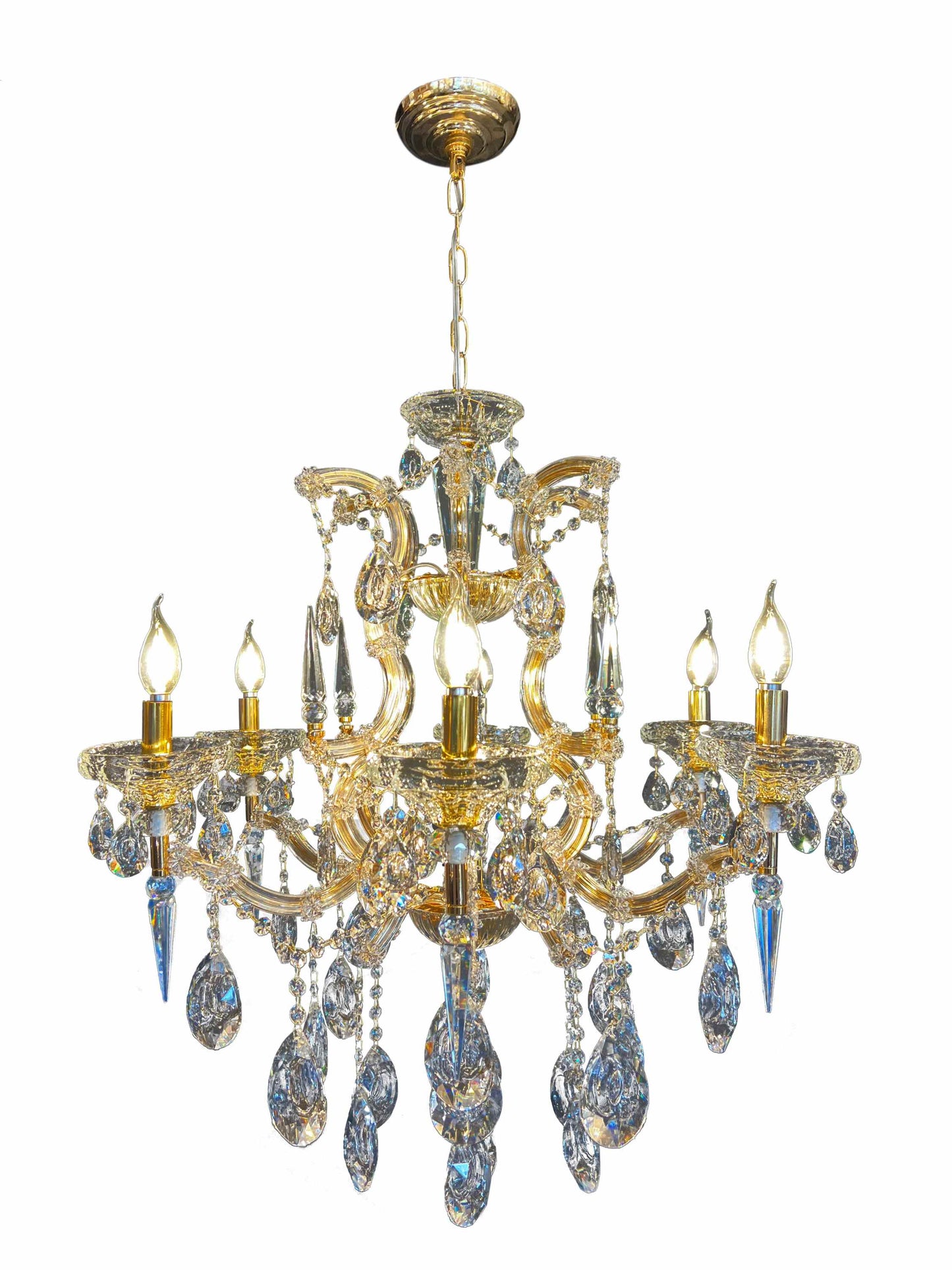 Close-up of 30% full-lead teardrop crystals on gold Maria Theresa chandelier.