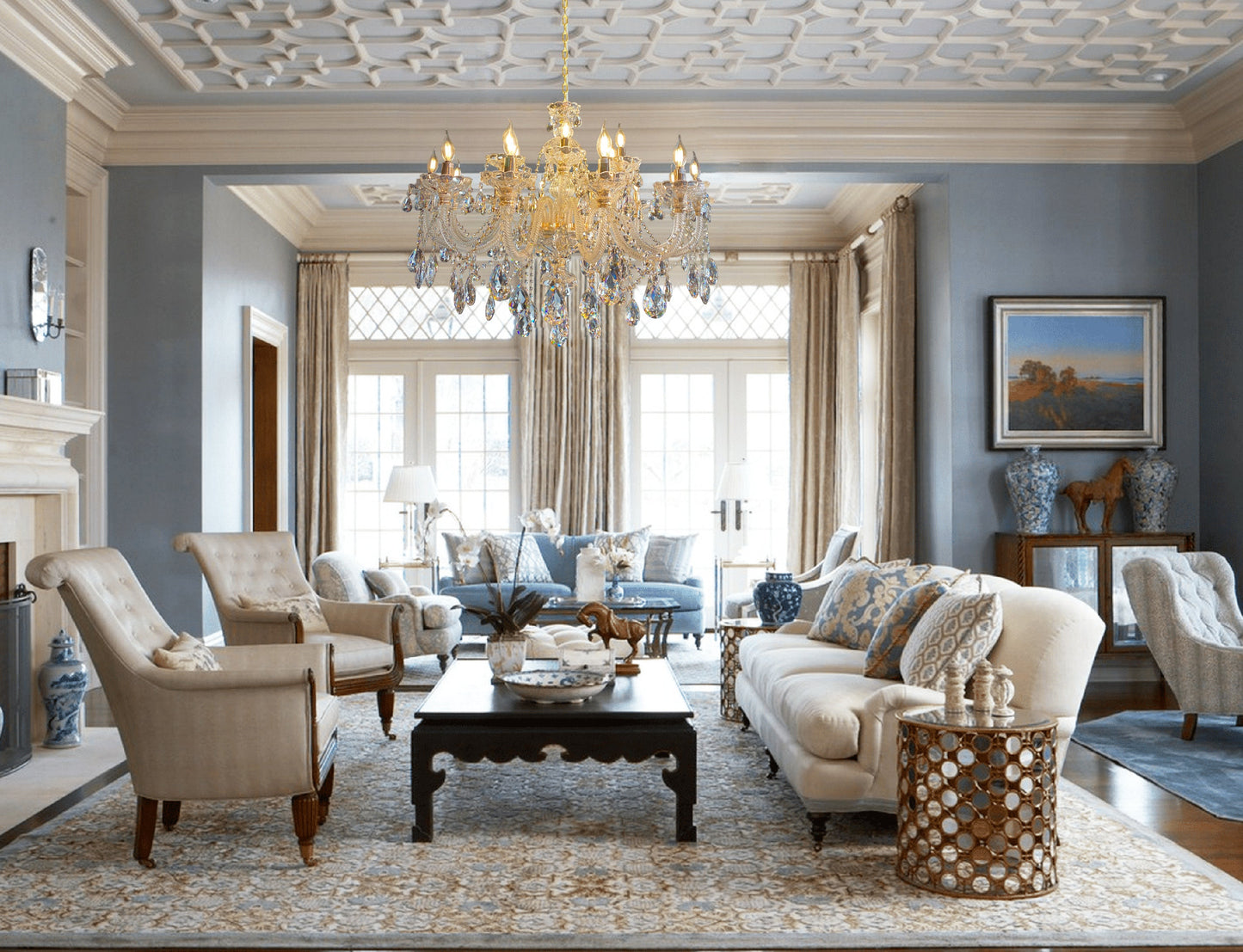 Luxury sitting area illuminated by a Gold crystal chandelier.
