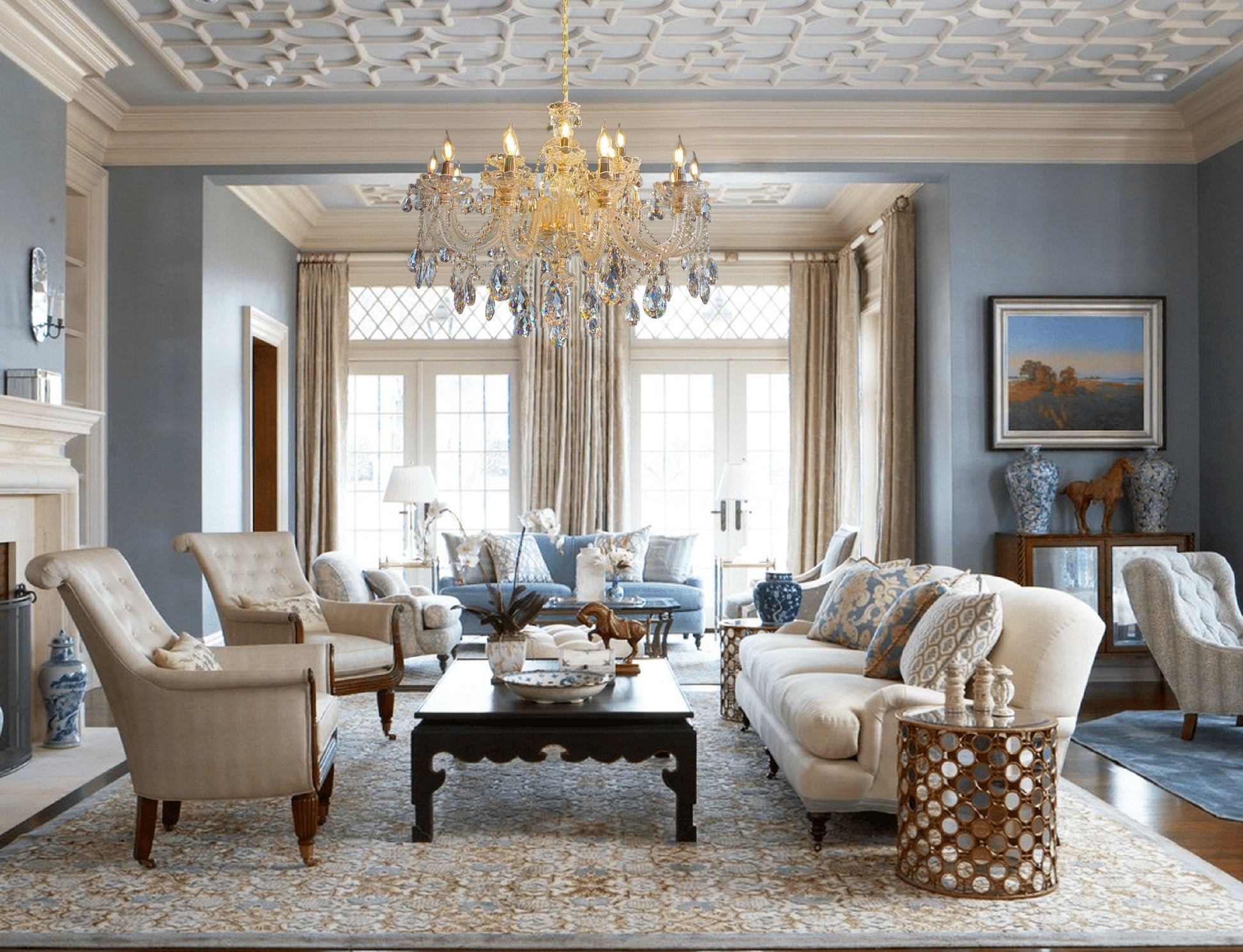 Luxury sitting area illuminated by a Gold crystal chandelier.
