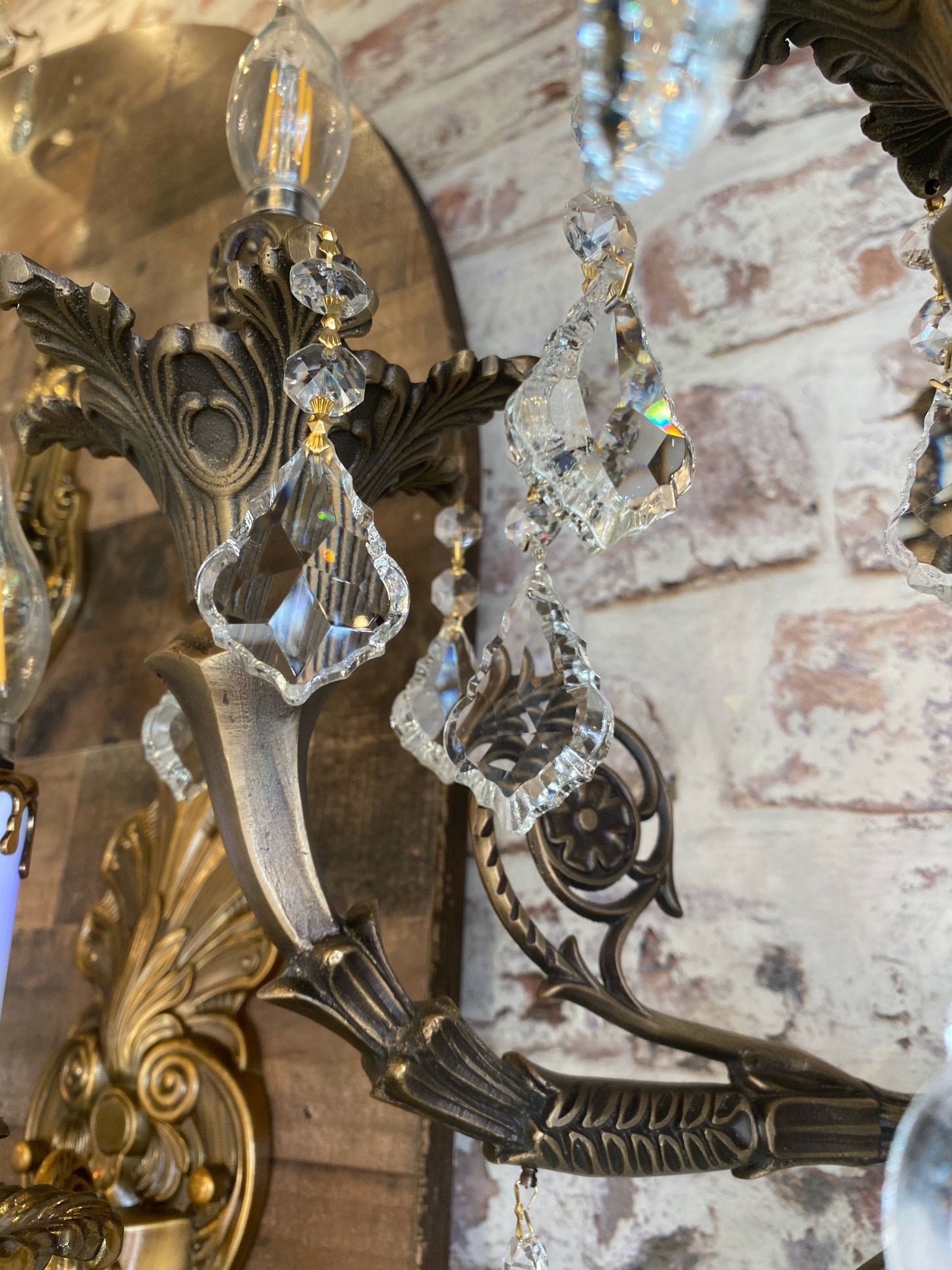 Detailed view of handmade brass wall sconce with crystals