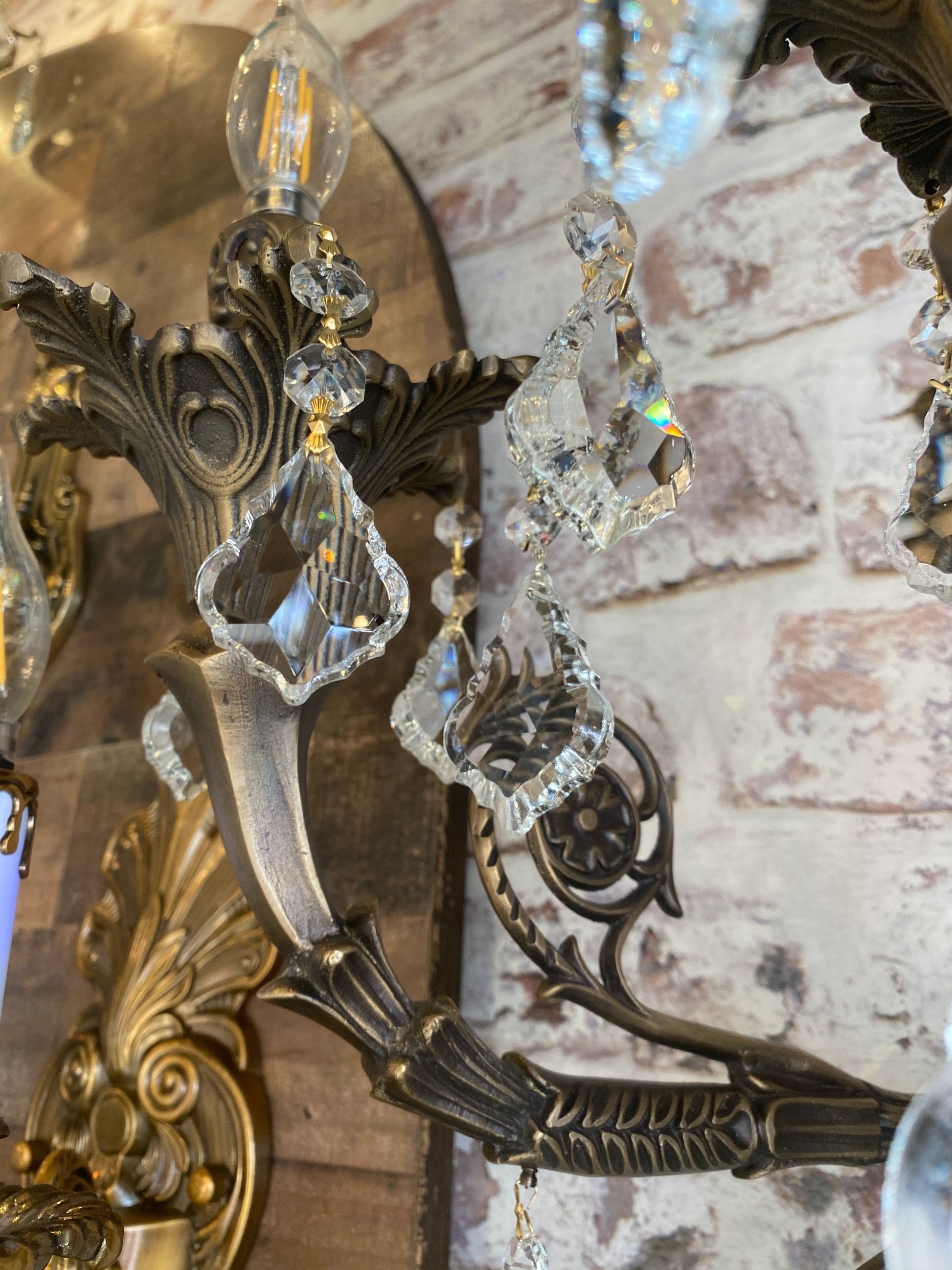 Detailed view of handmade brass wall sconce with crystals