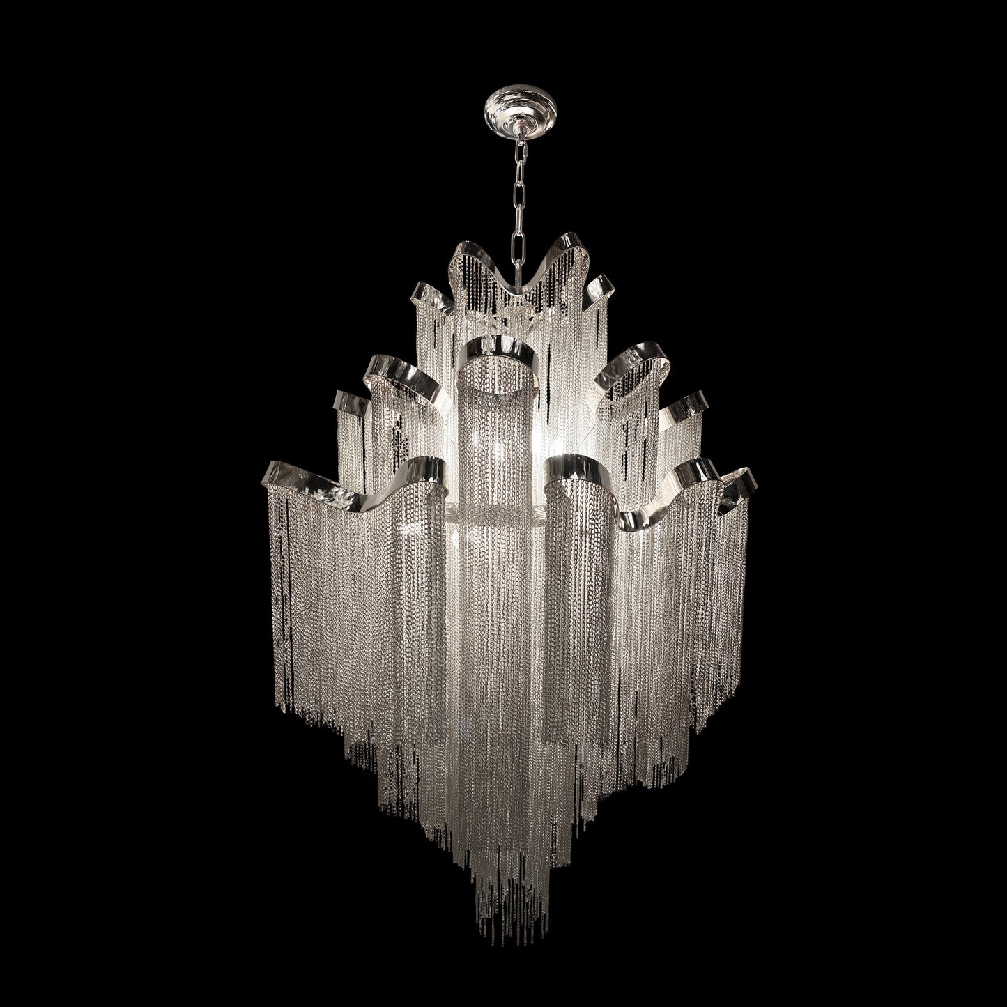 Full view of luxury chrome chain chandelier featuring cascading metal chains in a multi tier waterfall design on a black background.
