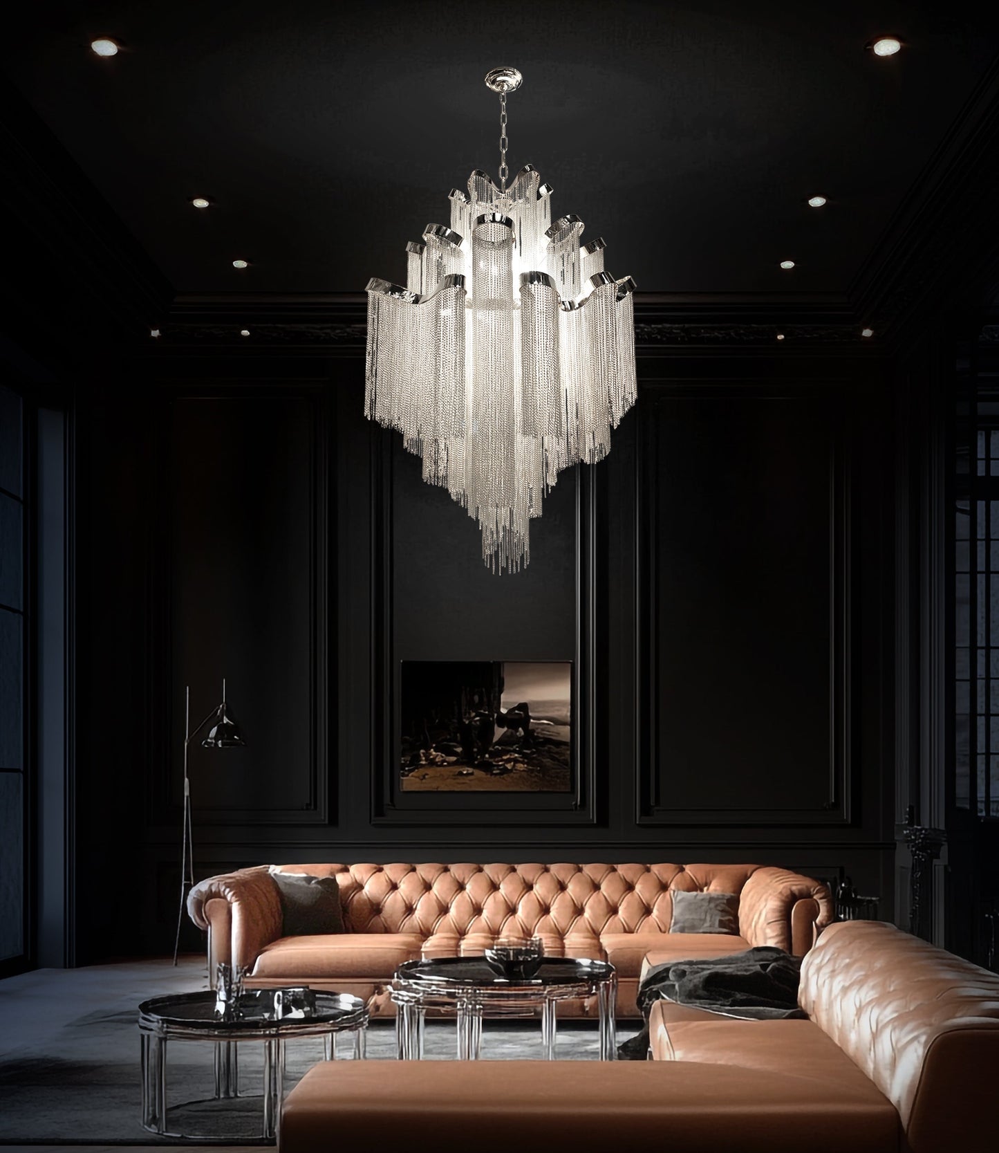 Modern chrome chain chandelier lighting up a high ceiling living room with a refined contemporary ambiance.