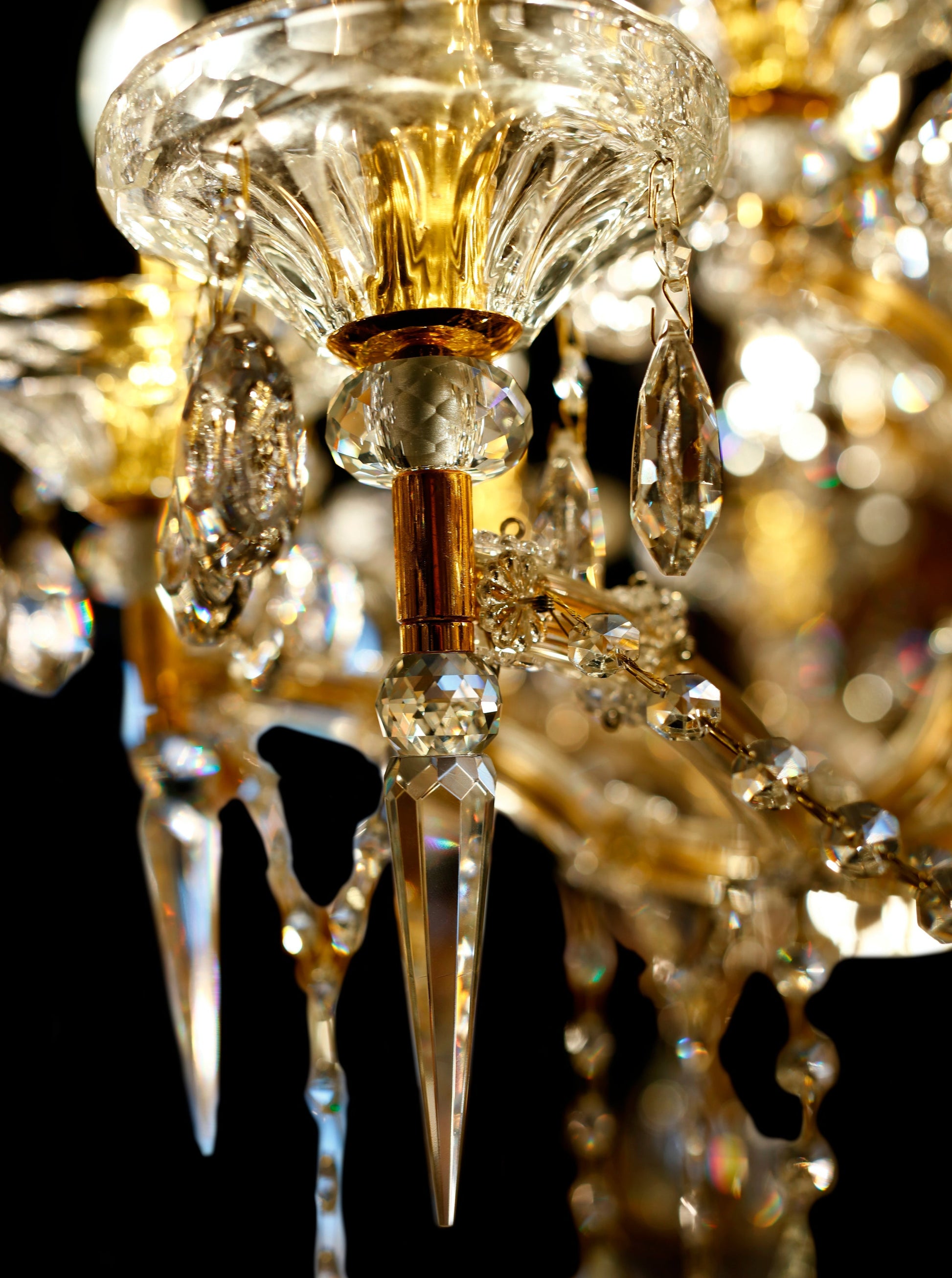 Close-up of the glass arm and teardrop lead crystal on Maria Theresa chandelier.
