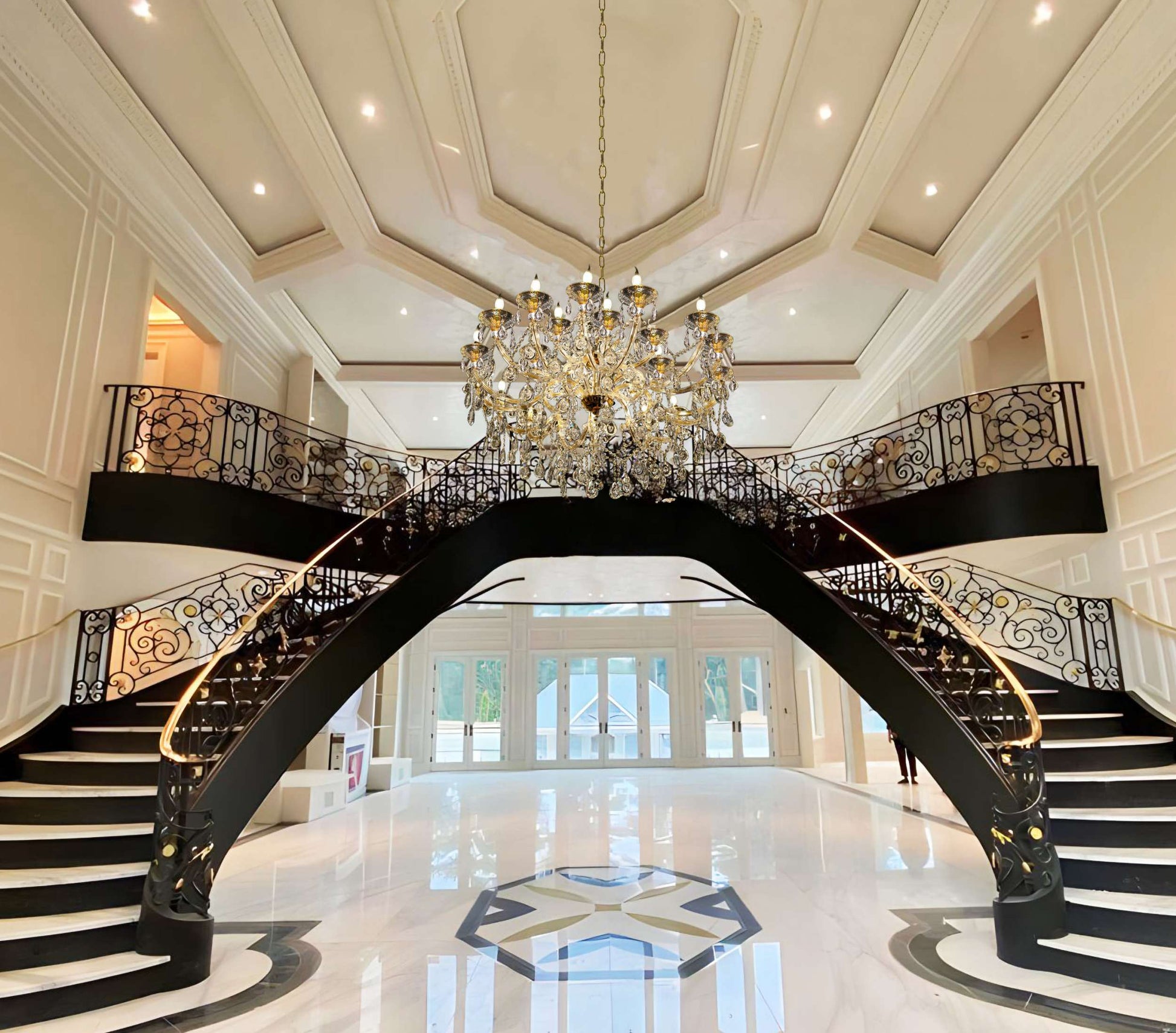 Large 45-inch Maria Theresa chandelier in grand foyer interior