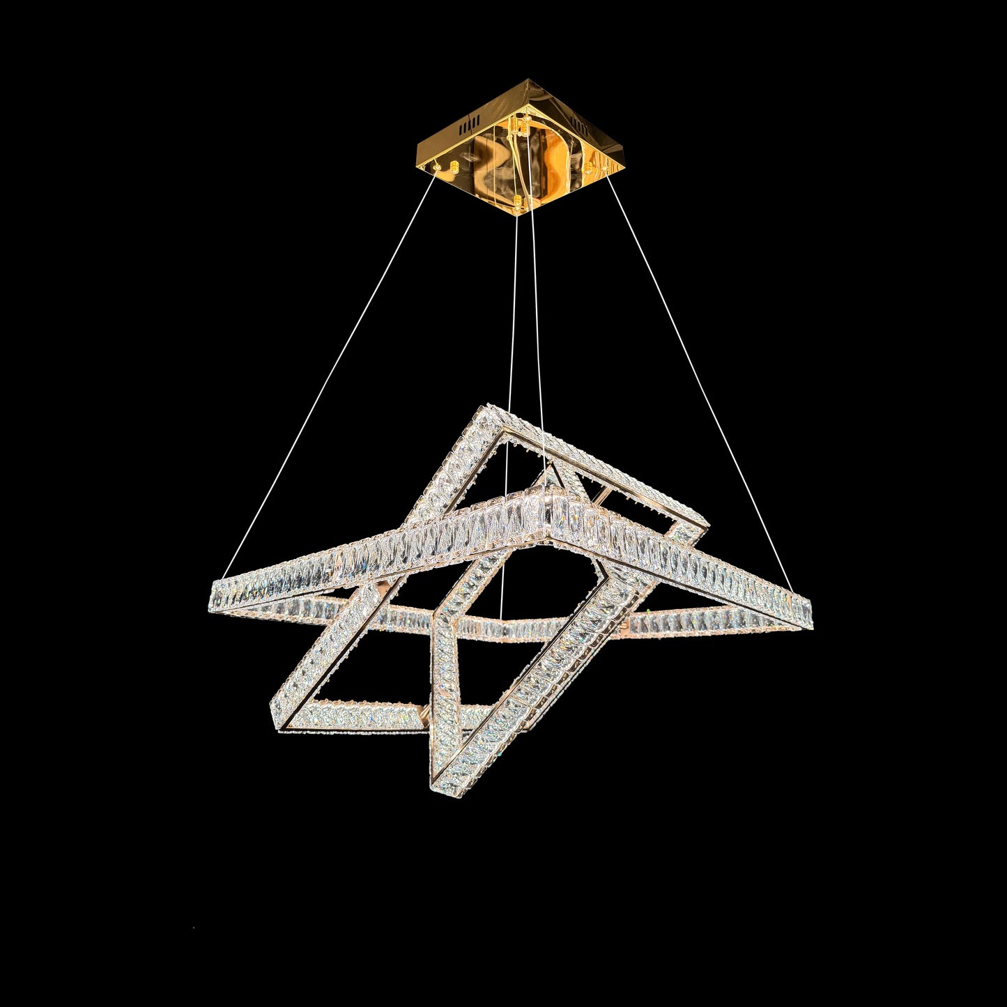 Modern 3-tier luxury gold crystal chandelier with LED lighting on a black background.
