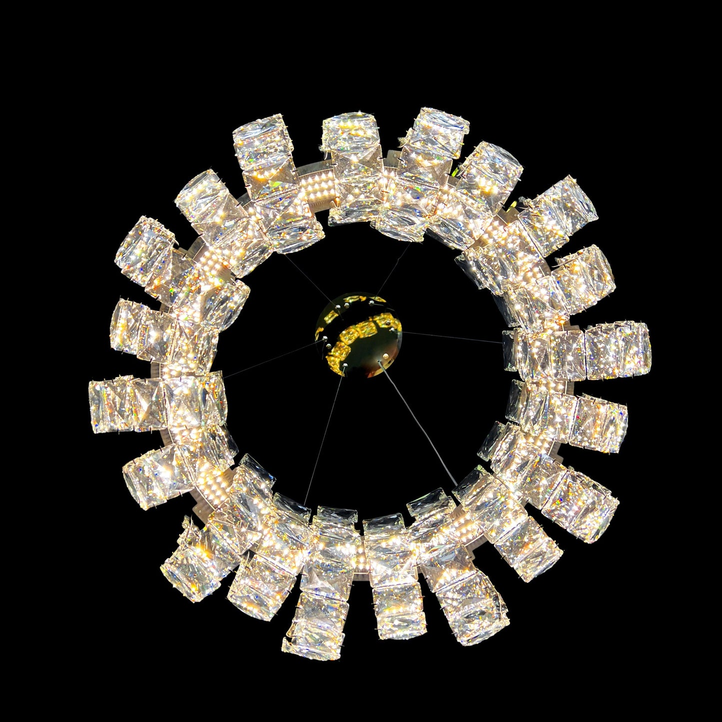 Bottom view of the circular gold dimmable crystal chandelier showcasing the multi-faceted LED crystals.
