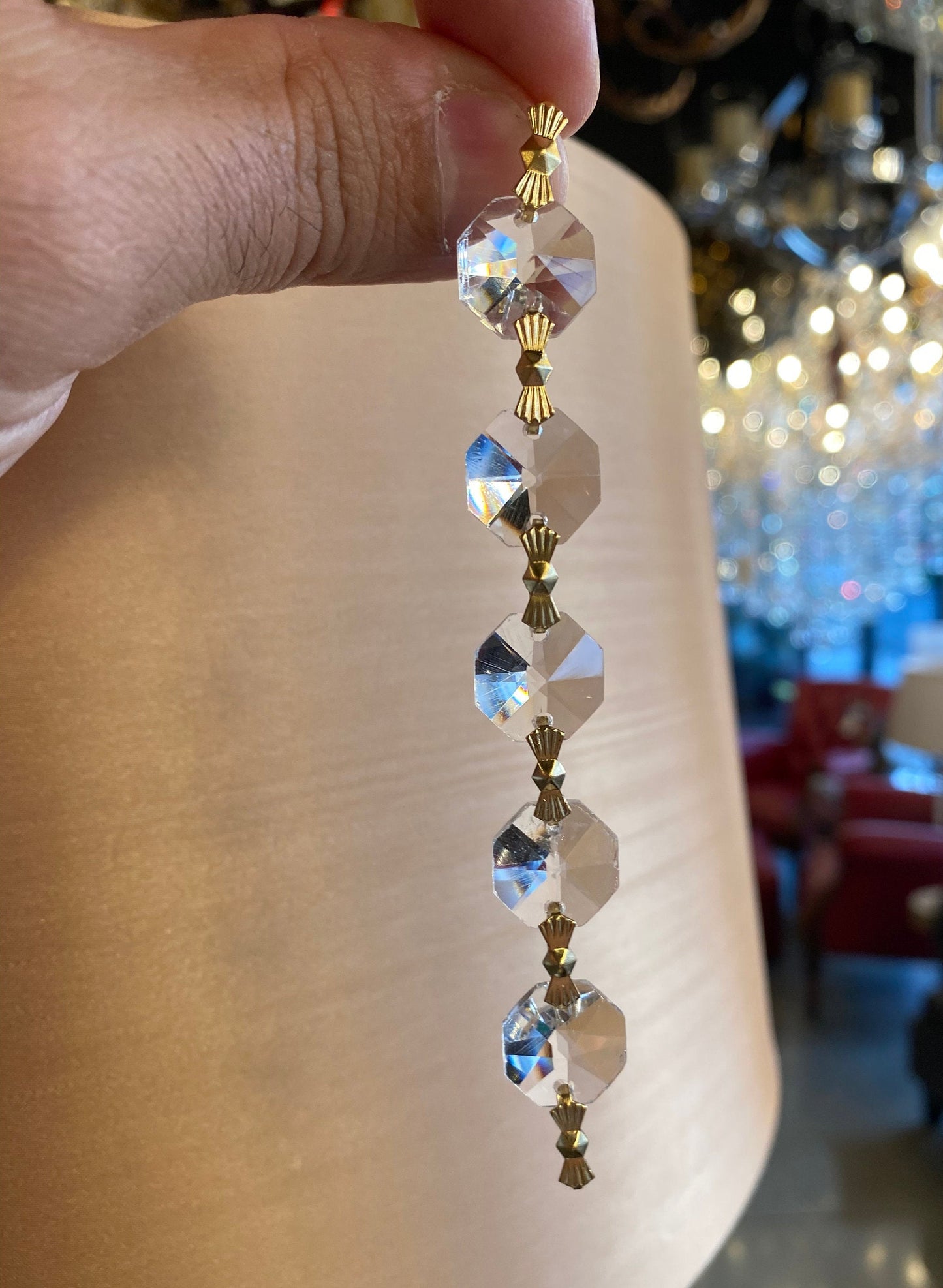 Single crystal strand with golden brass clip detail