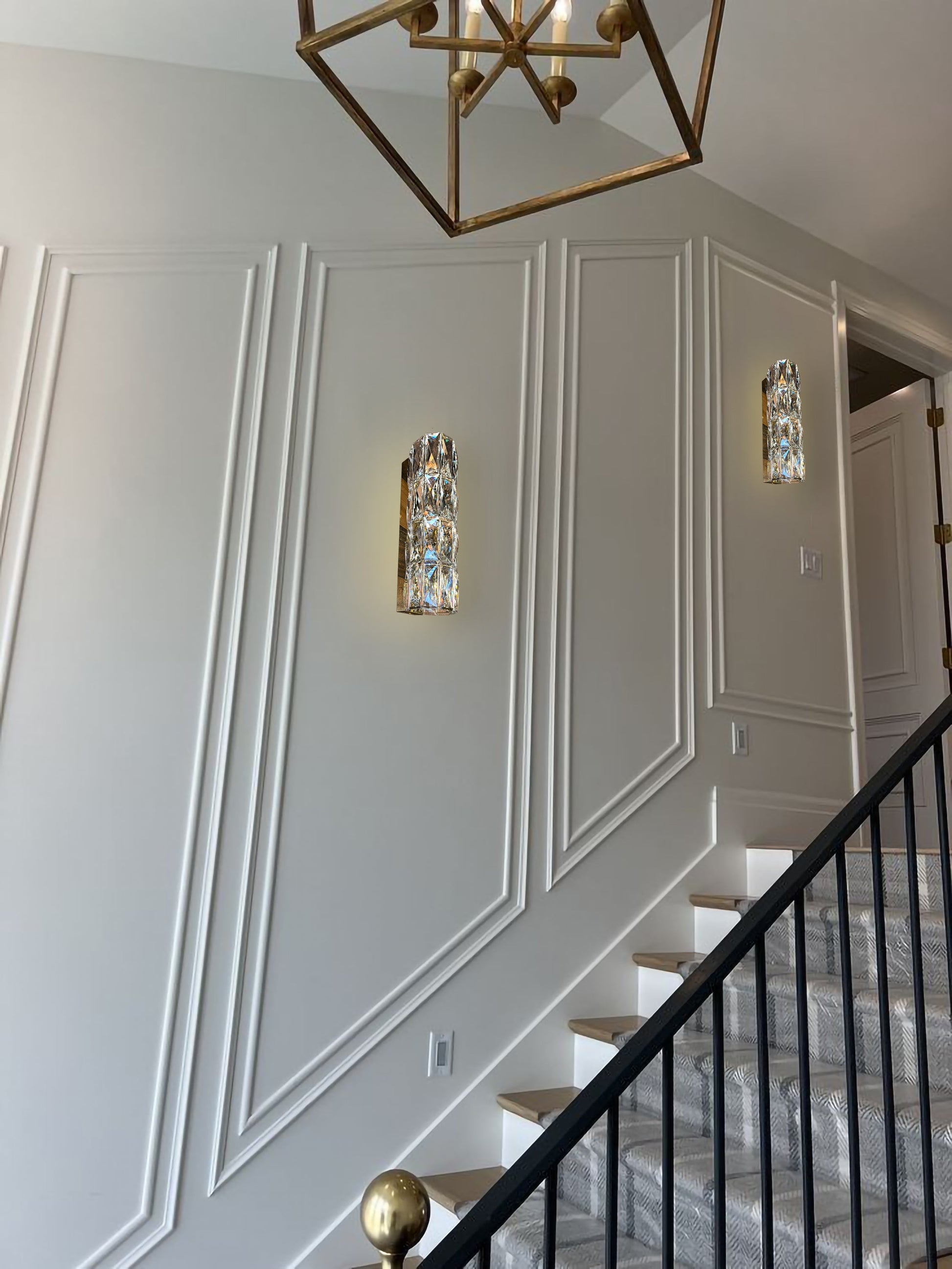 Slim LED wall sconce along luxury staircase