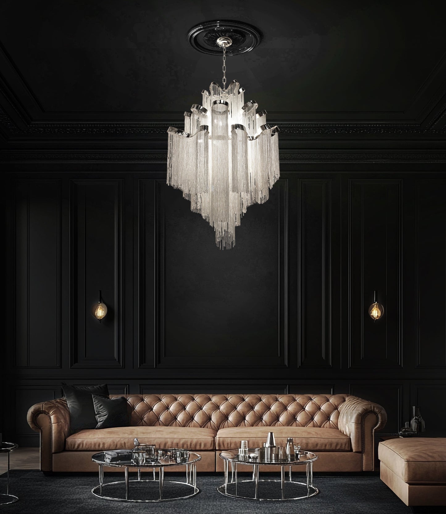 Luxury chrome waterfall chandelier suspended above a brown leather sofa in a designer modern living space.
