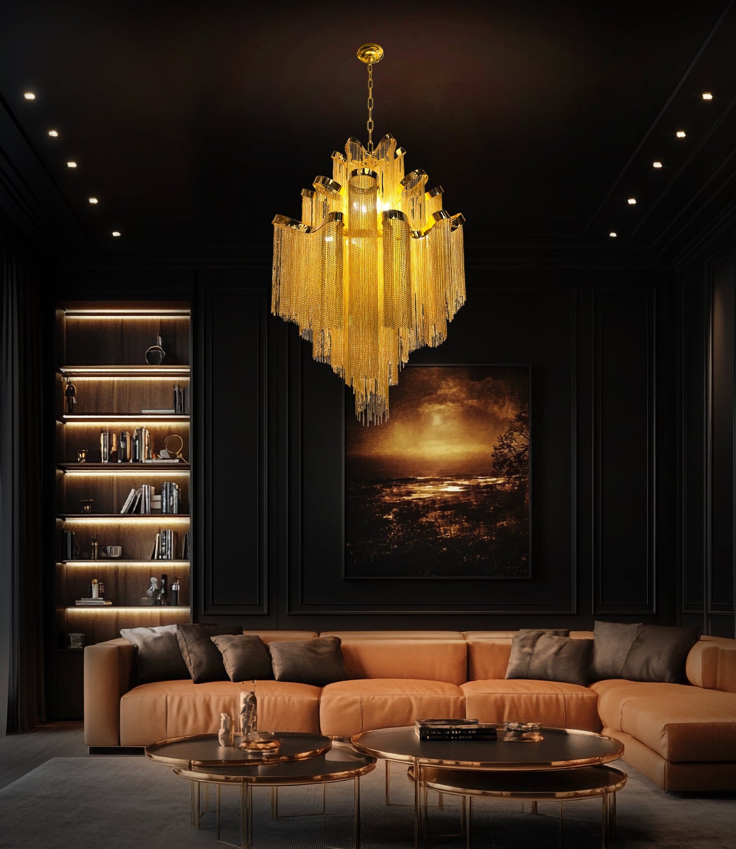 Luxury gold waterfall chandelier suspended above a brown leather sofa in a designer modern living space.
