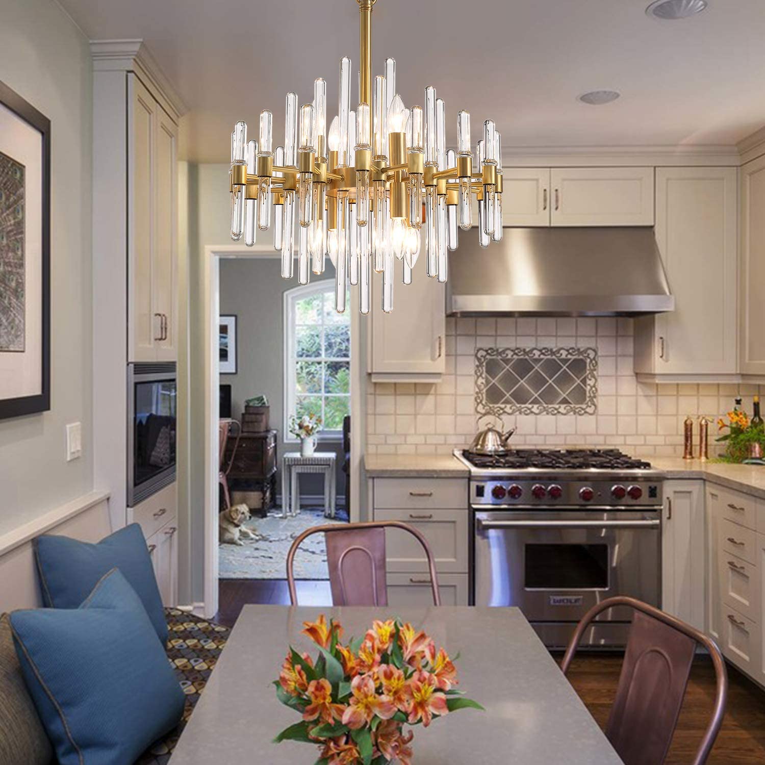 Luxury brass glass rod chandelier above modern kitchen table