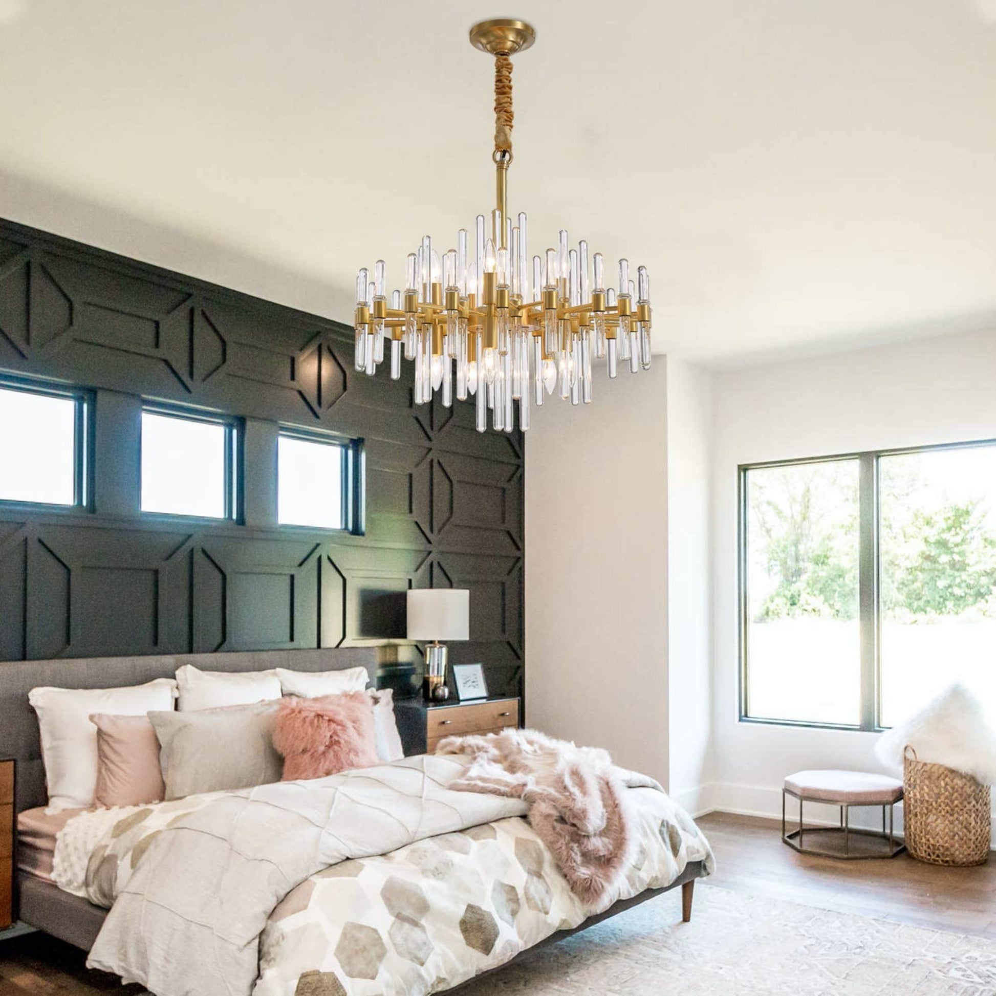 Elegant brass rod chandelier illuminating contemporary bedroom decor

