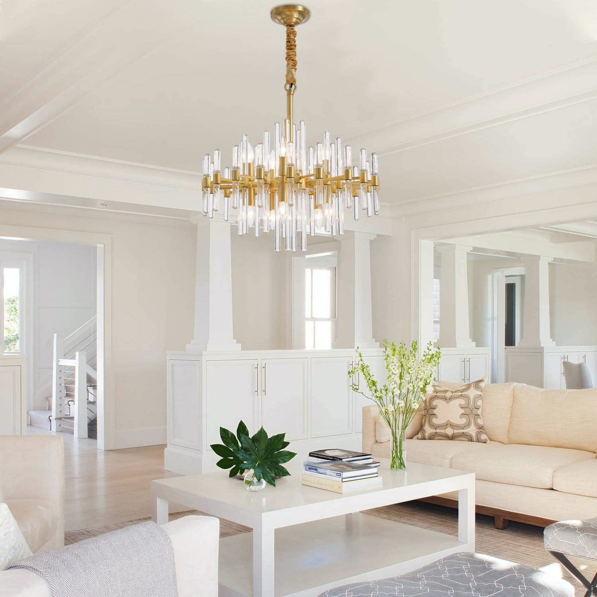 Modern gold glass rod chandelier in upscale family room setting
