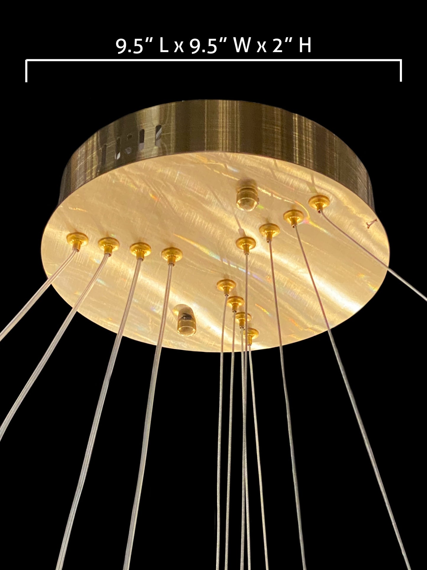 Brushed gold chandelier canopy detail with suspension cables