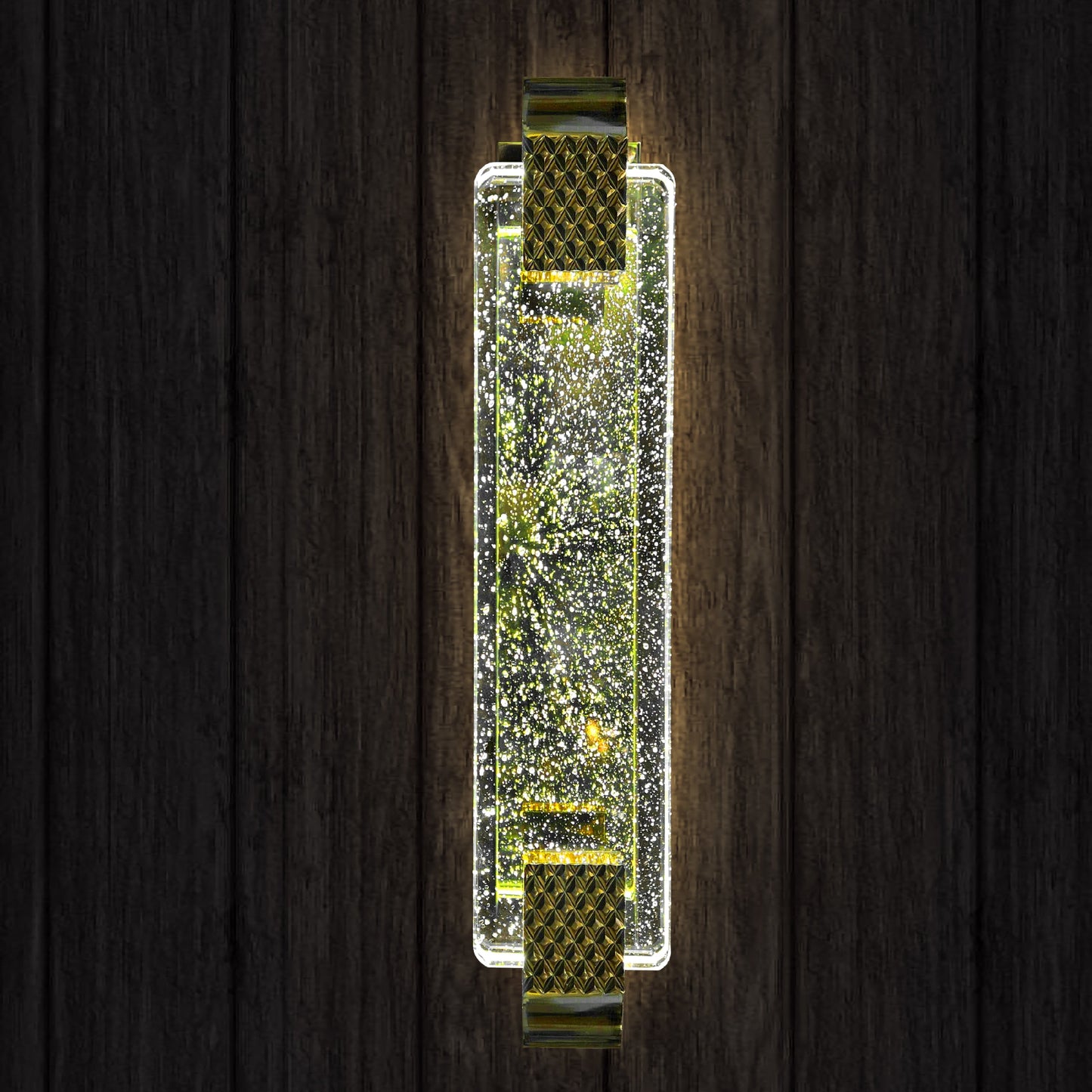 Decorative wall sconce with sparkling design on a wooden background