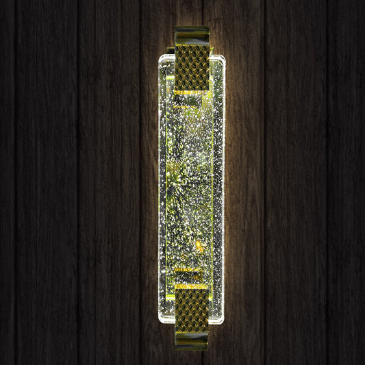Decorative wall sconce with sparkling design on a wooden background