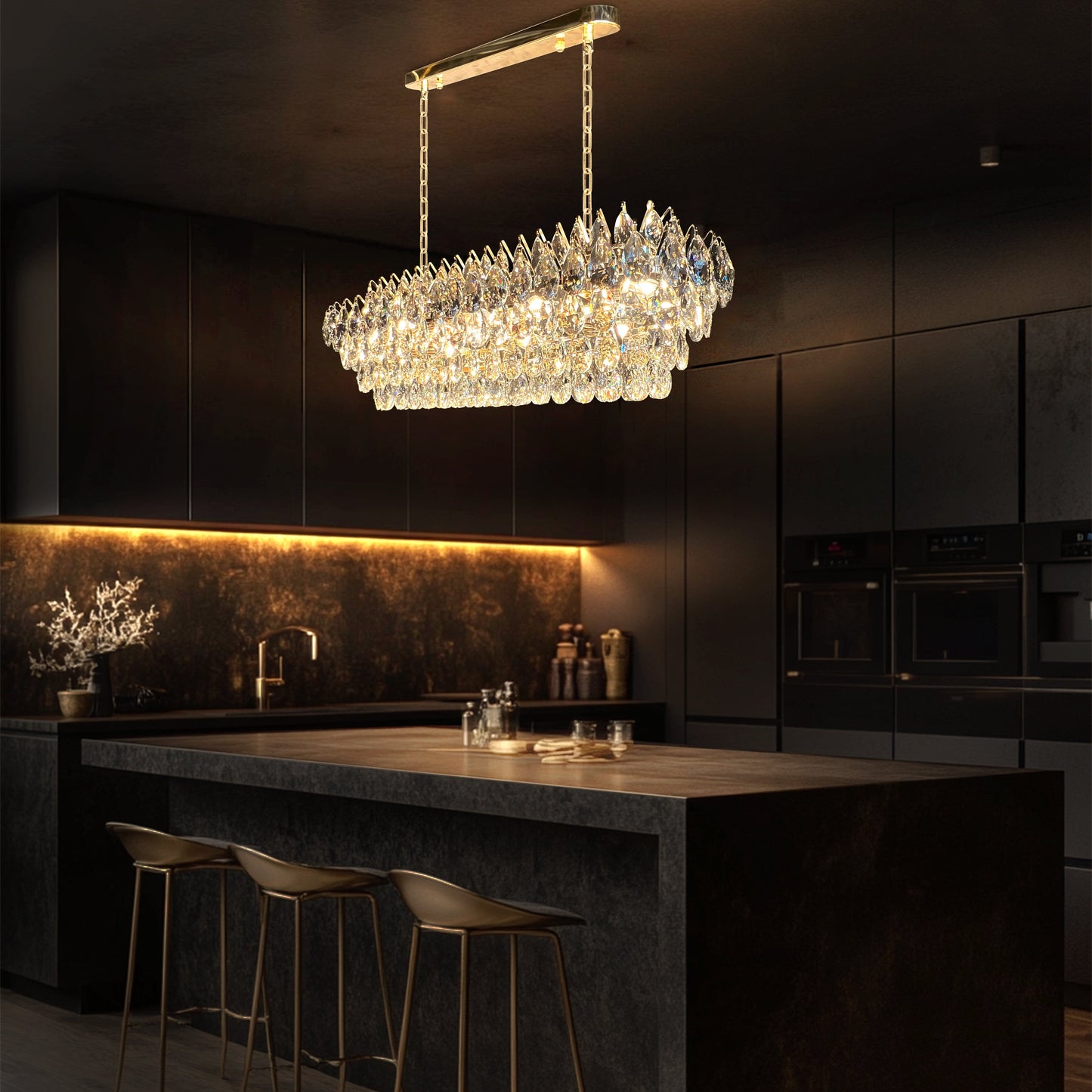 Champagne gold rectangular crystal chandelier with teardrop K9 crystals and a polished linear empire-style design illuminated in warm light.