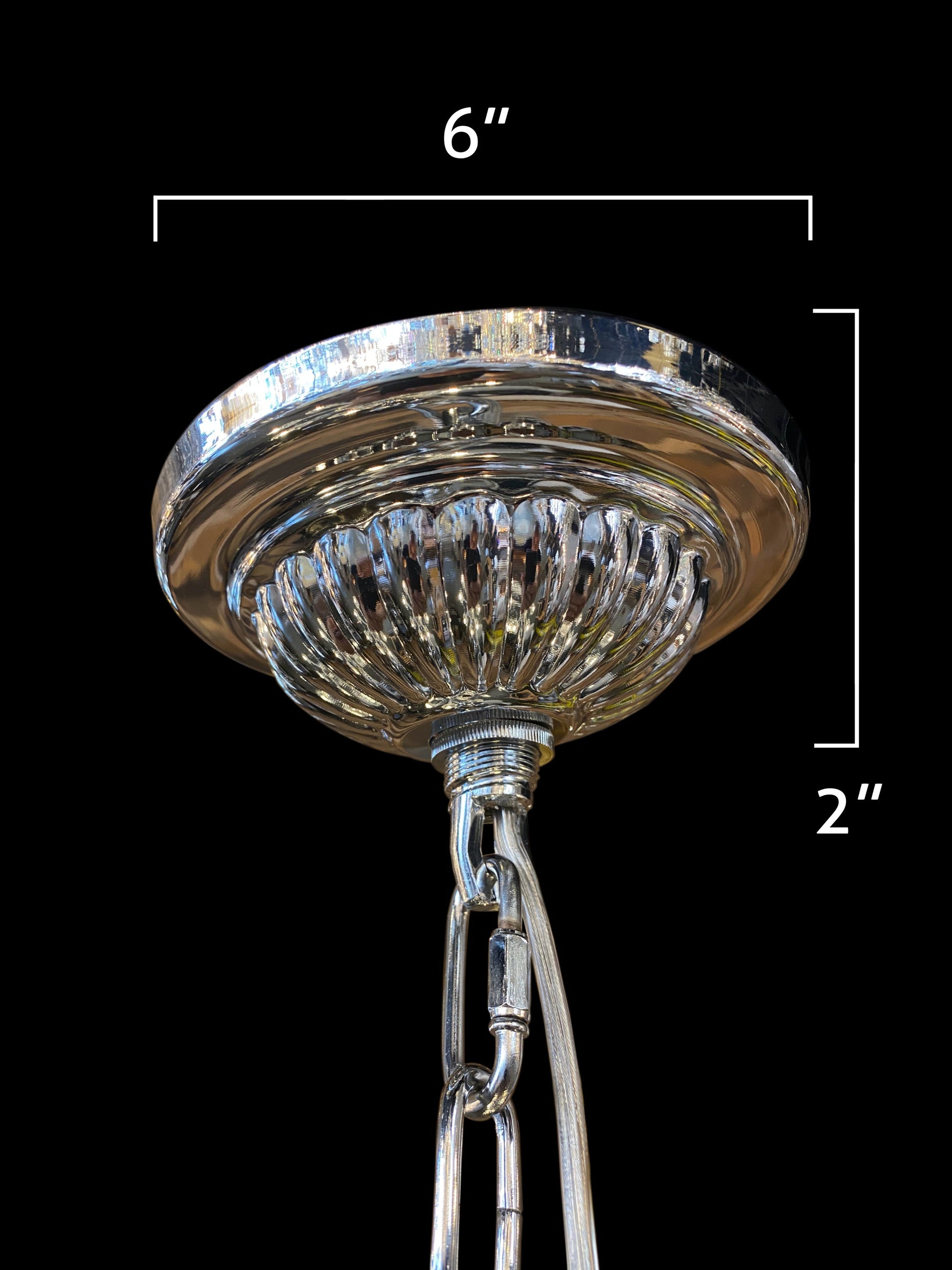 Close-up view of the chrome chandelier canopy detail.
