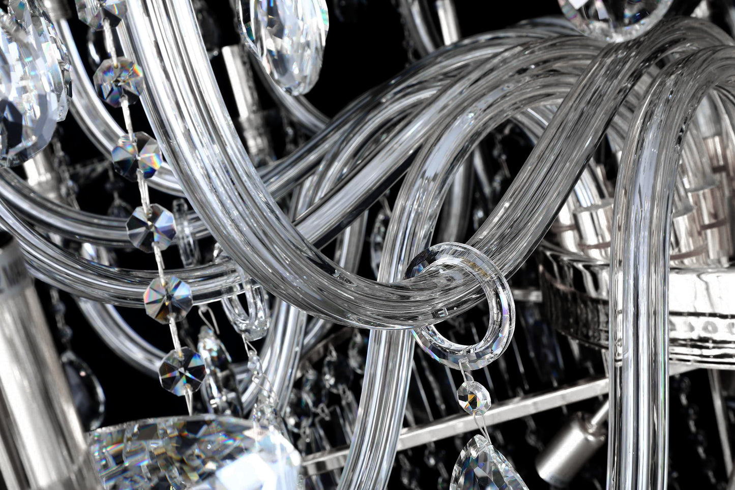 Detailed view of curved crystal arms and polished chrome frame for radiant reflection.