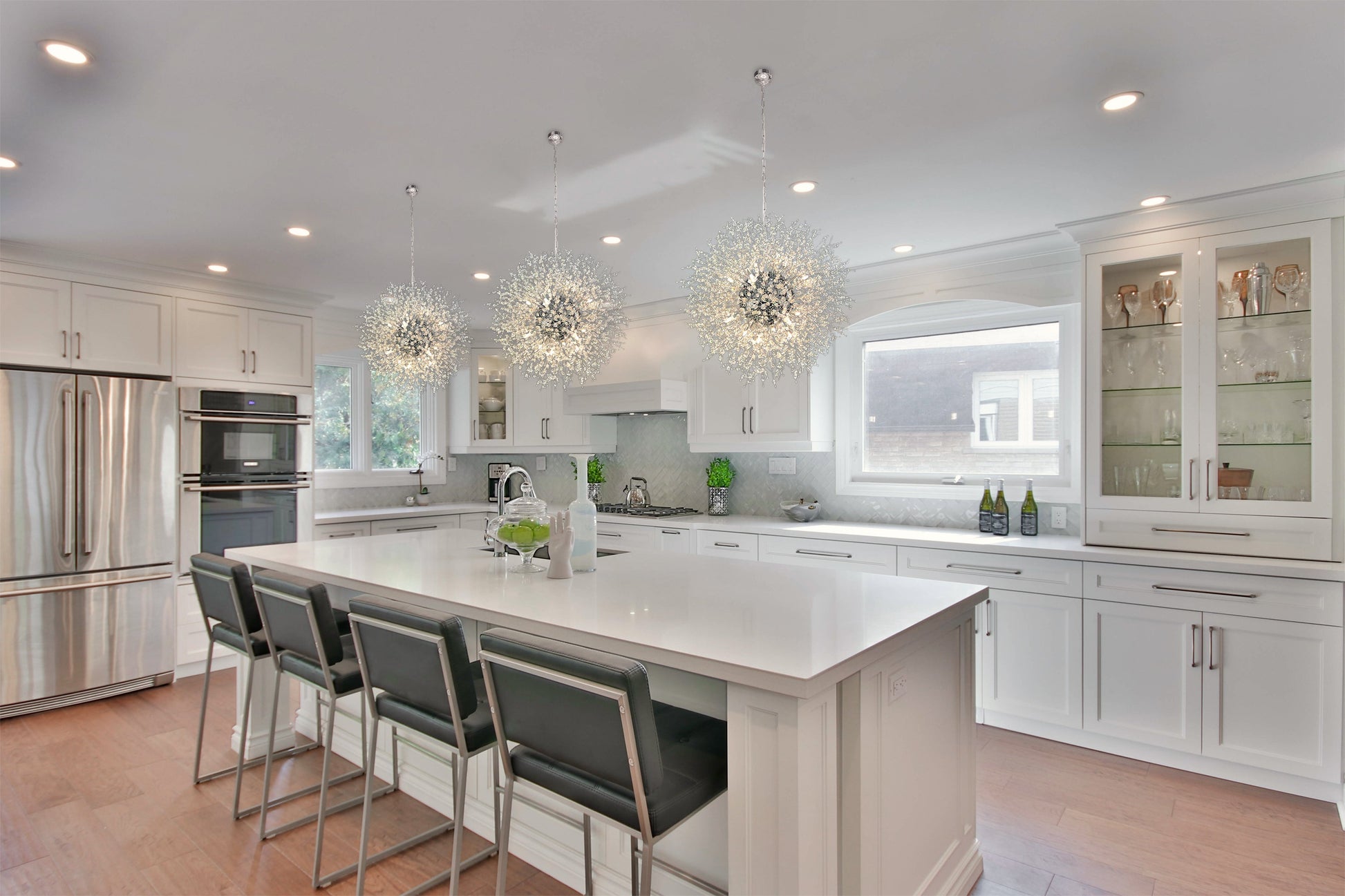 24 inch chrome starburst chandelier above contemporary dining table