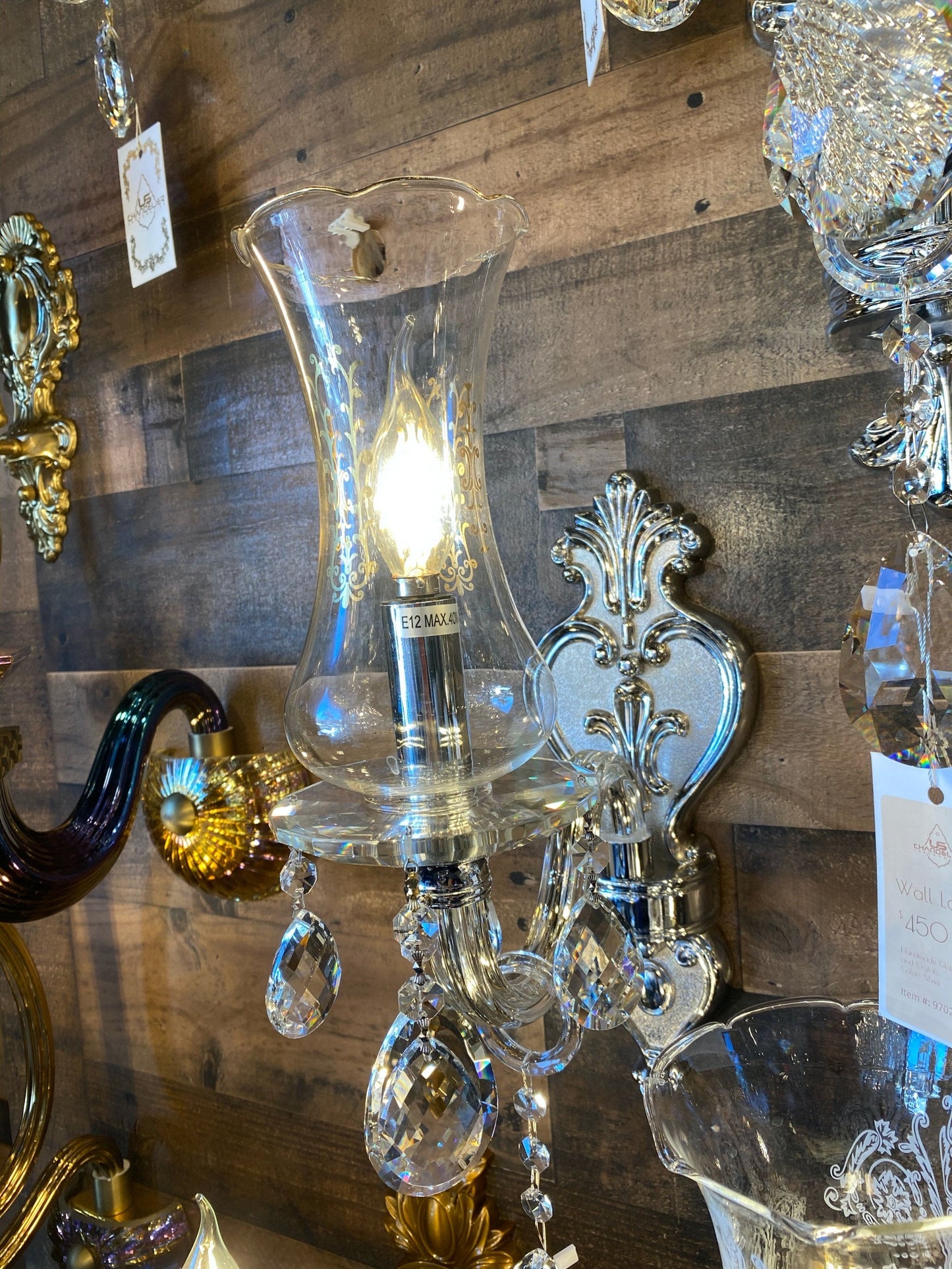 Glass lamp shade installed on wall sconce