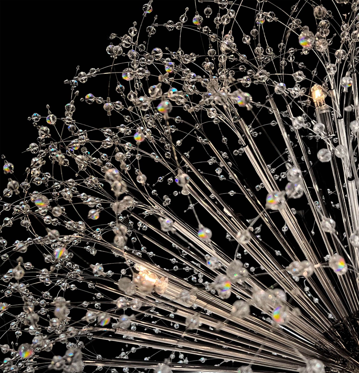  Close-up of precision-cut crystal branches with chrome finish