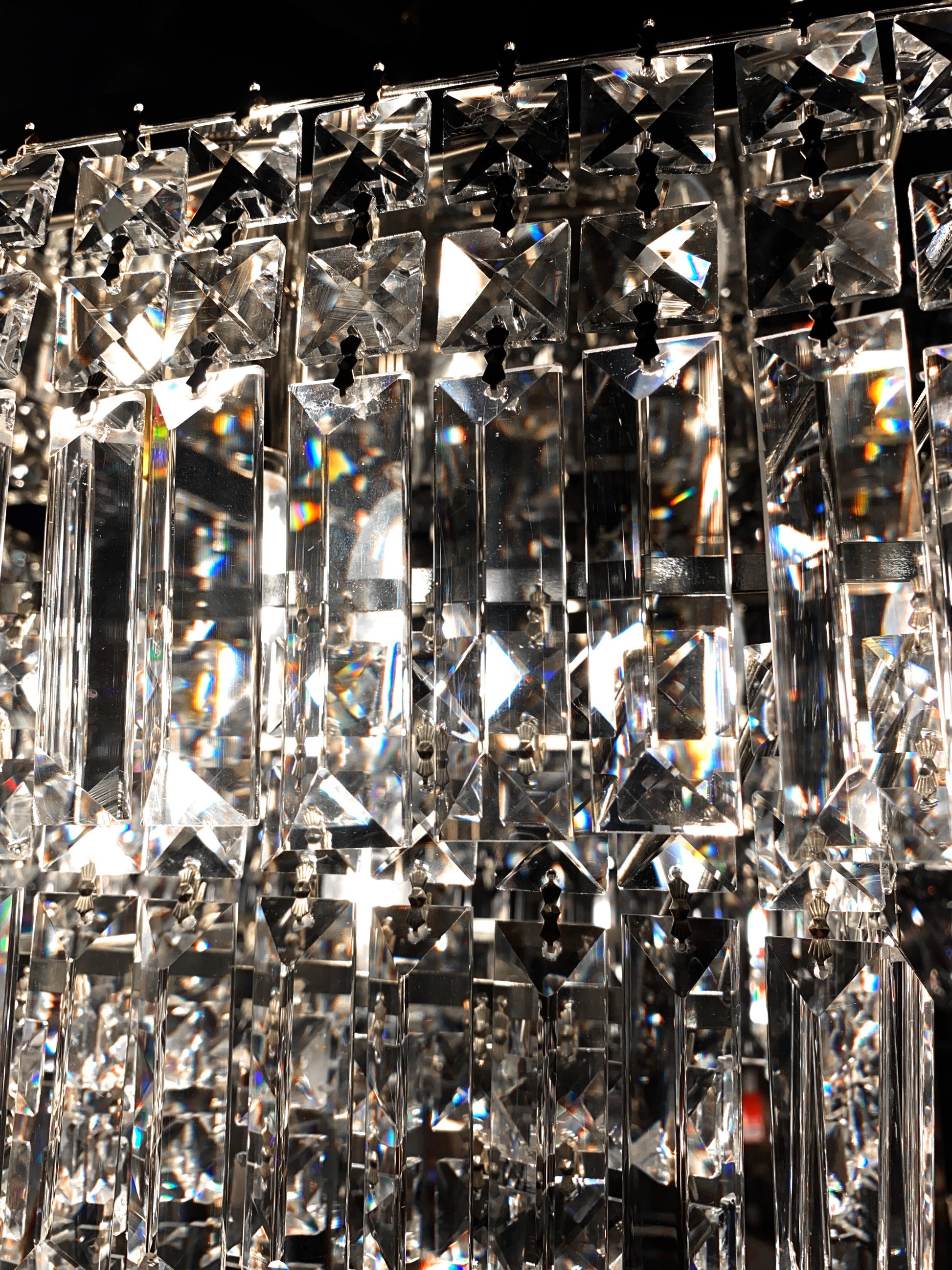 Close up detail of chrome crystal chandelier premium prisms