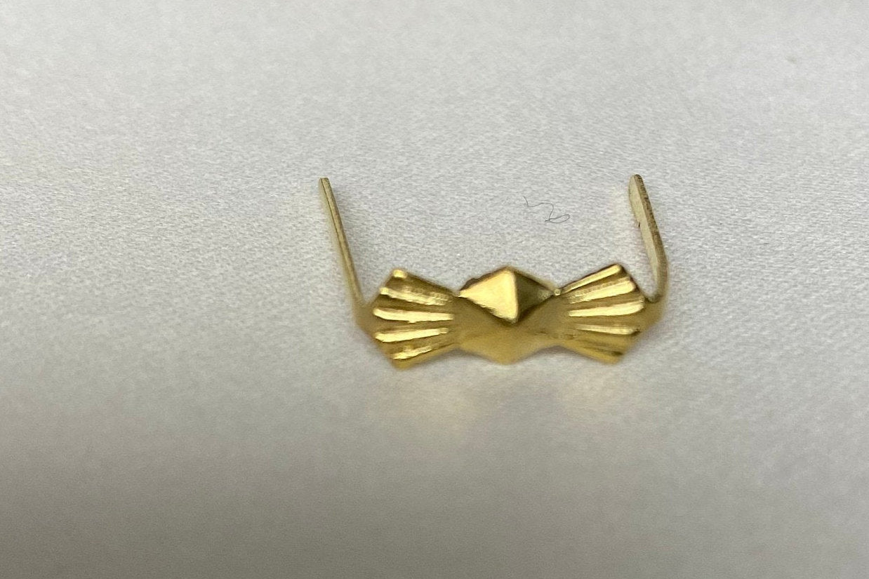Metal clip accessory included with crystal round pendant for easy installation