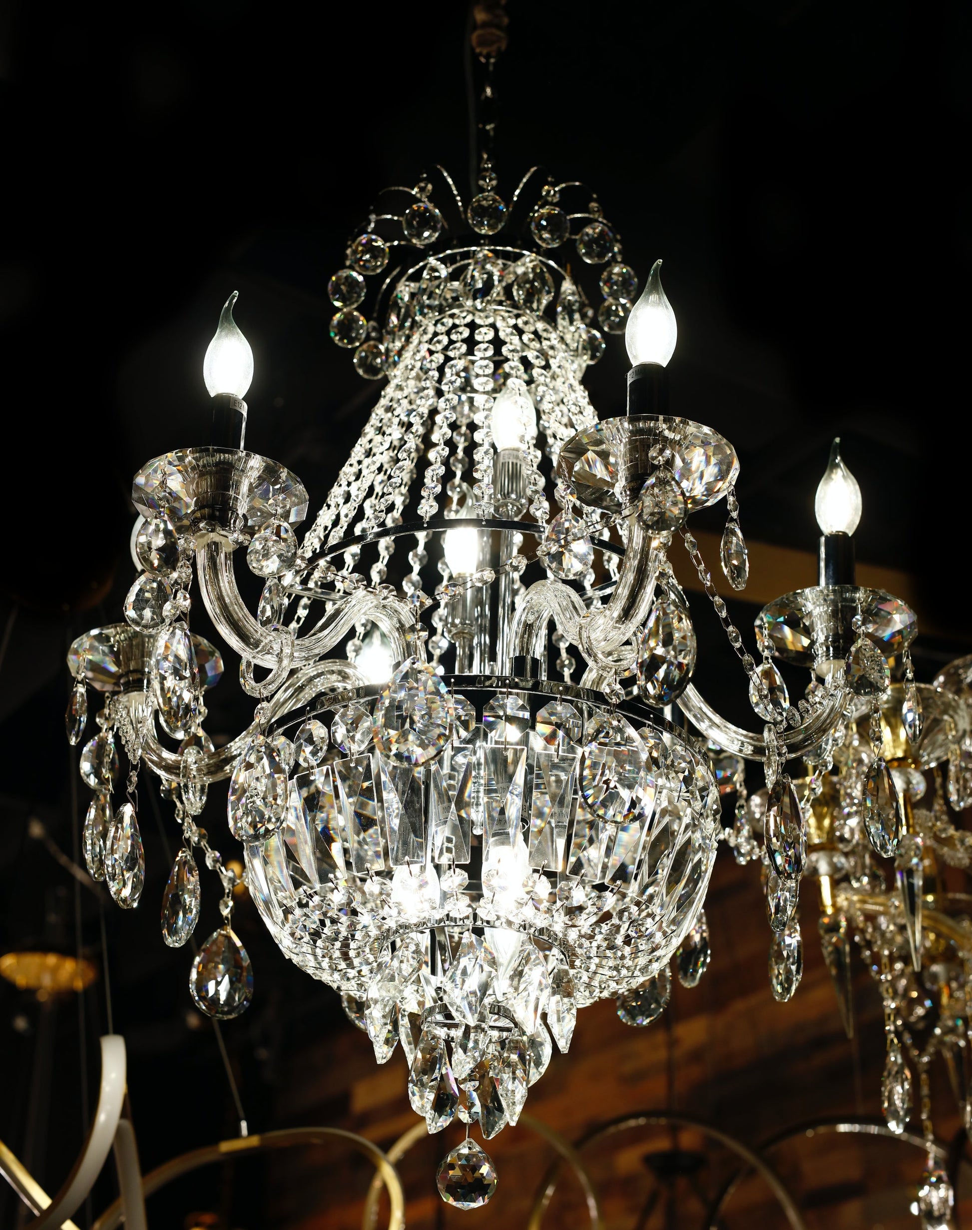 Close-up view of precision-cut crystal drops and chrome finish chandelier arms