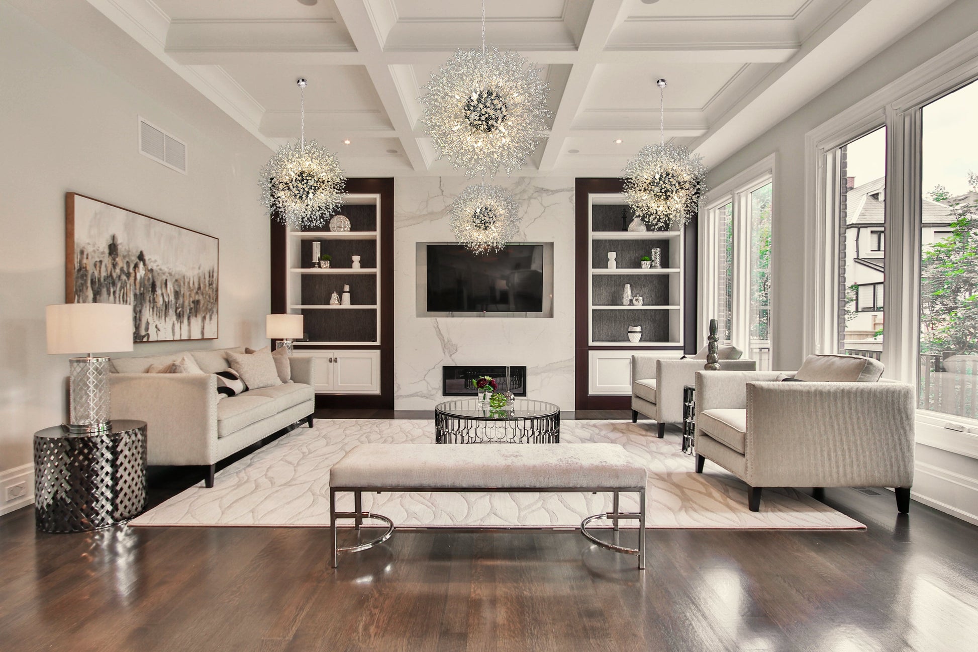 Chrome crystal chandelier illuminating modern living room with refined elegance