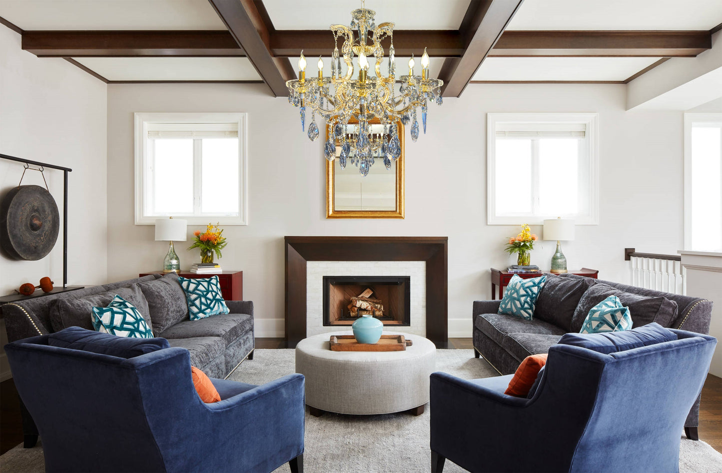 Maria Theresa gold crystal chandelier styled in an elegant living room.