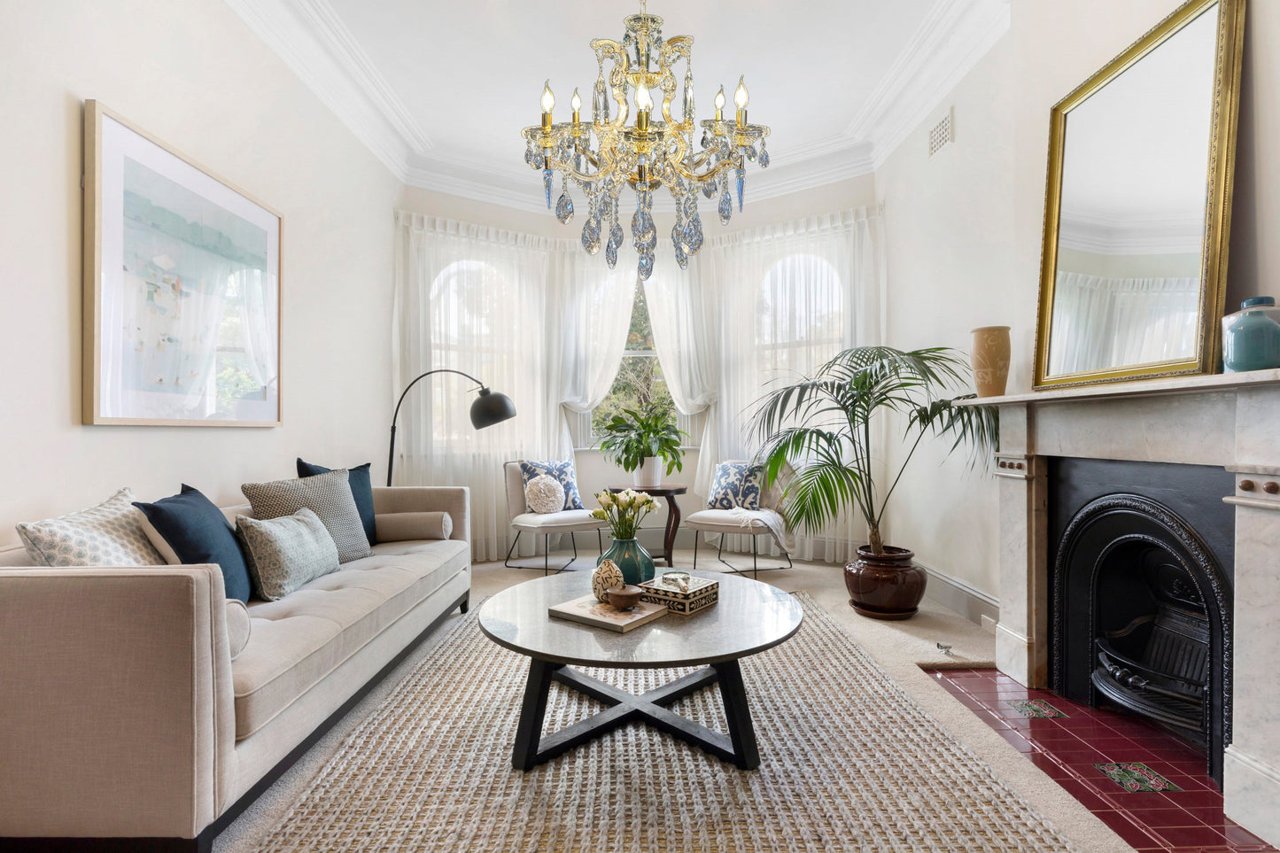 Gold crystal Maria Theresa chandelier in a traditional home interior.
