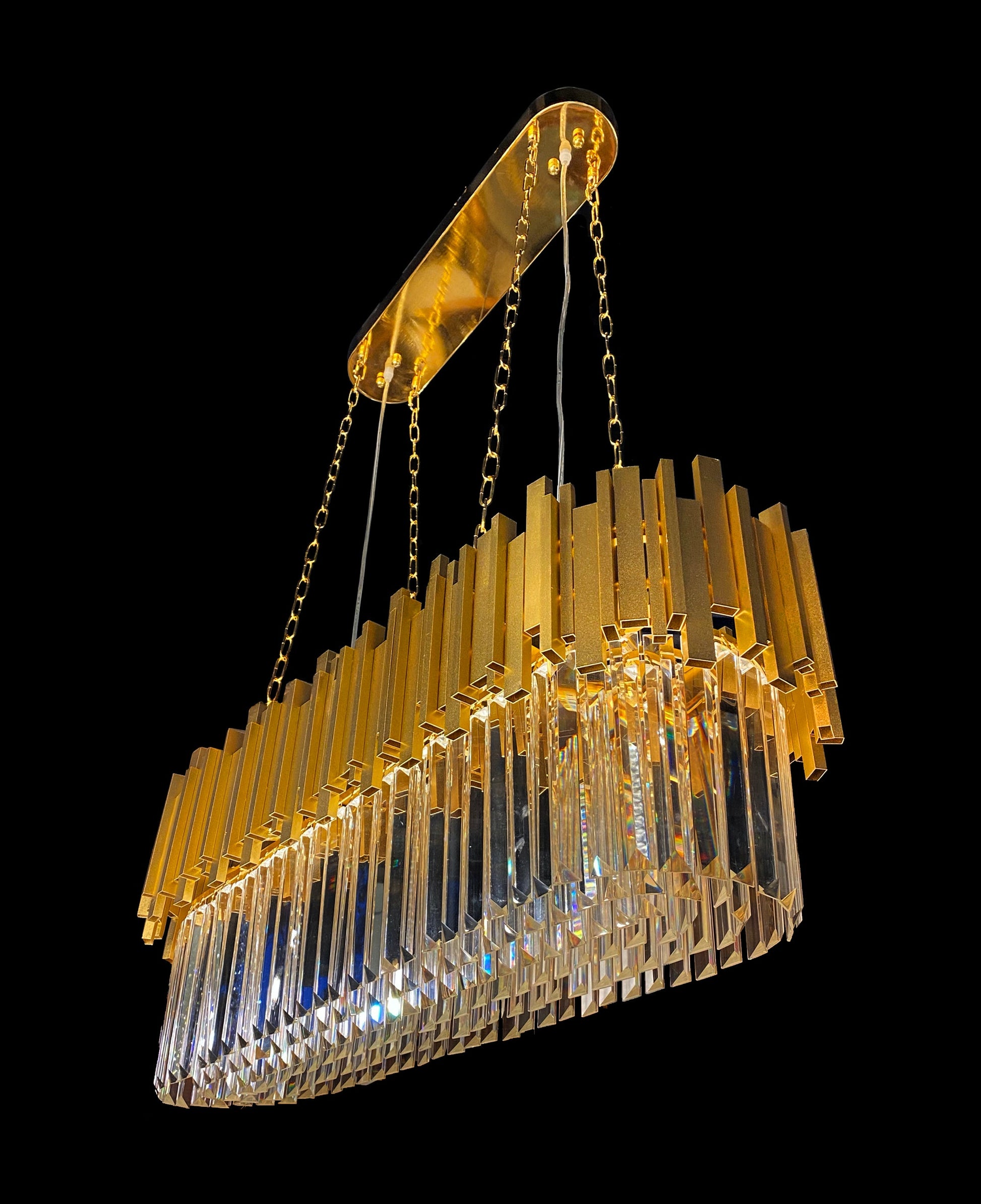 Side angle view showing layered gold and clear crystal prisms