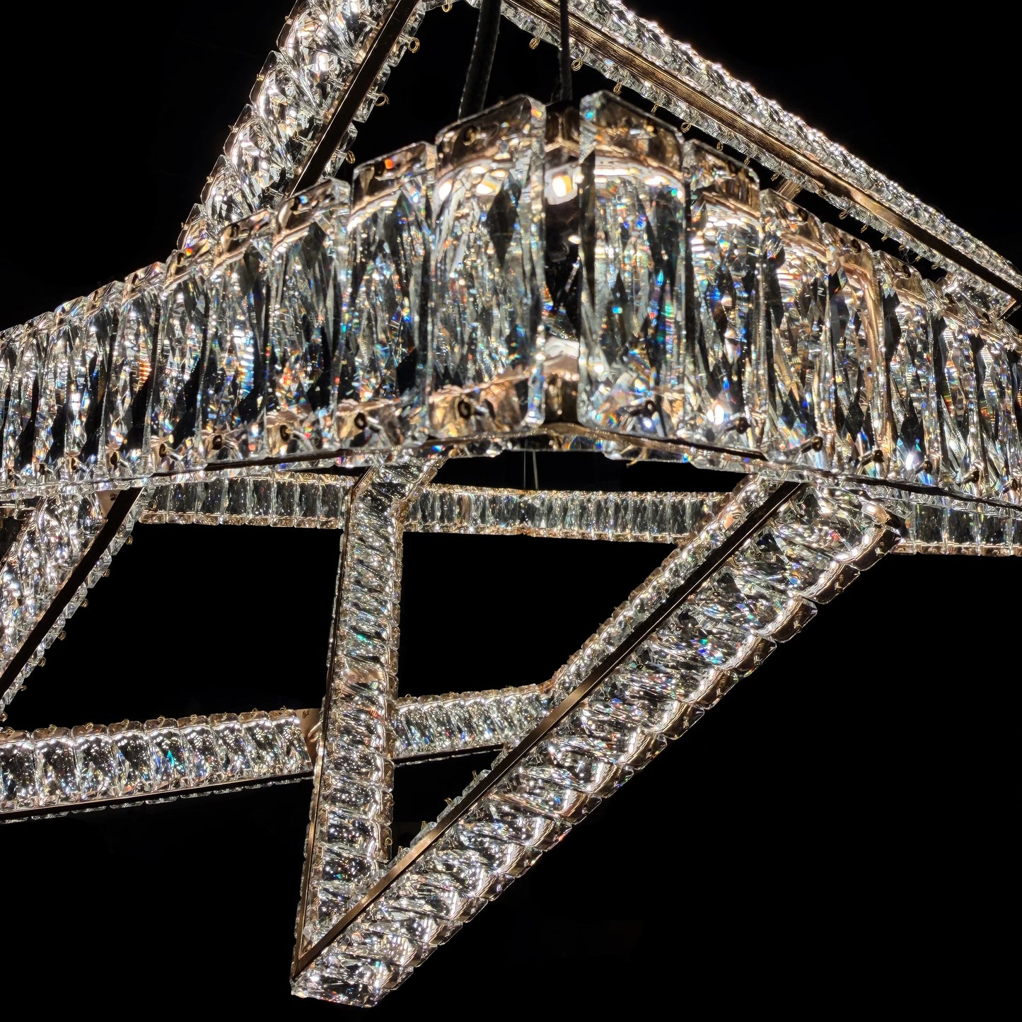  Close-up detail of the gold stainless steel frame and precision-cut crystals.