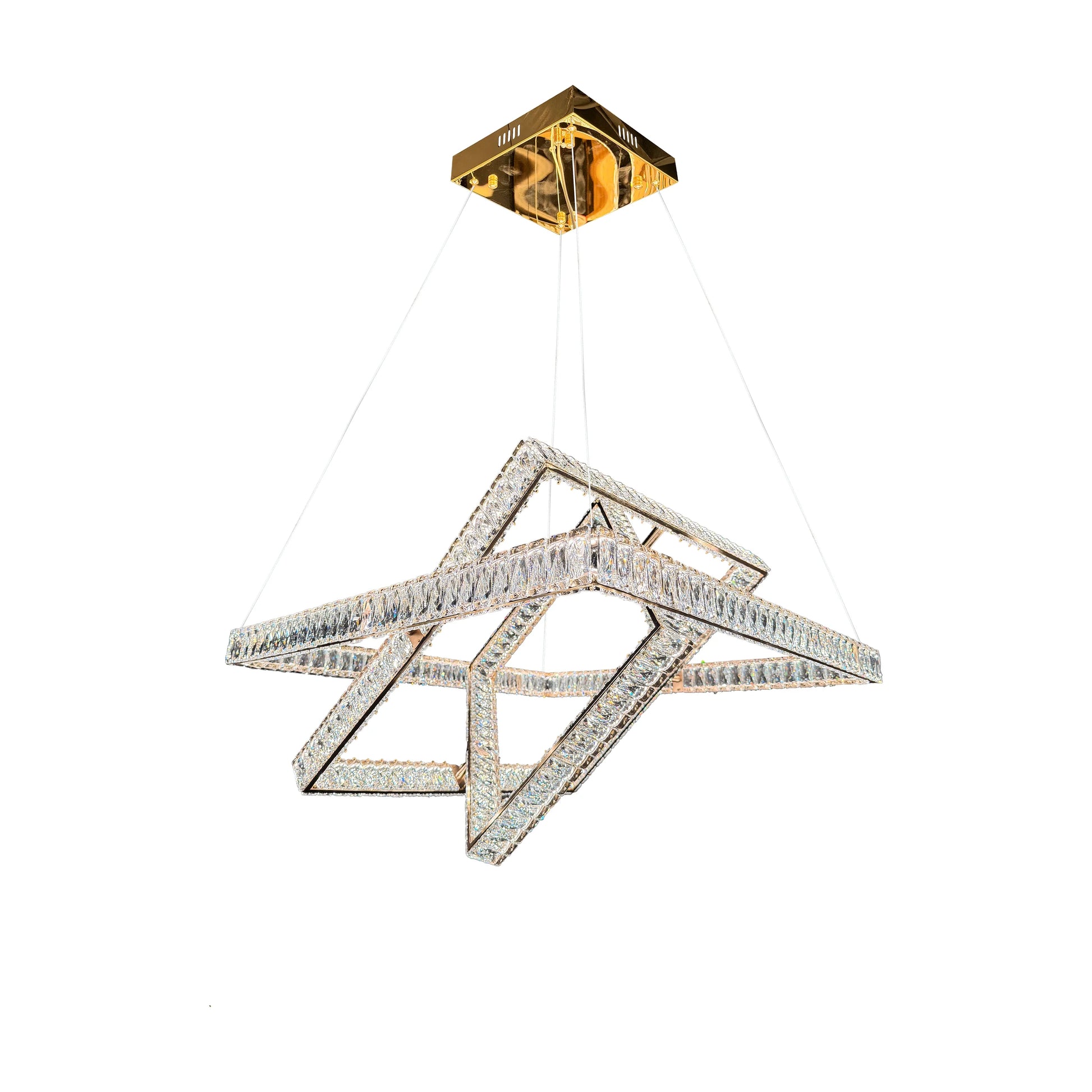 Studio shot of the modern 3-tier gold crystal chandelier isolated on a white background.