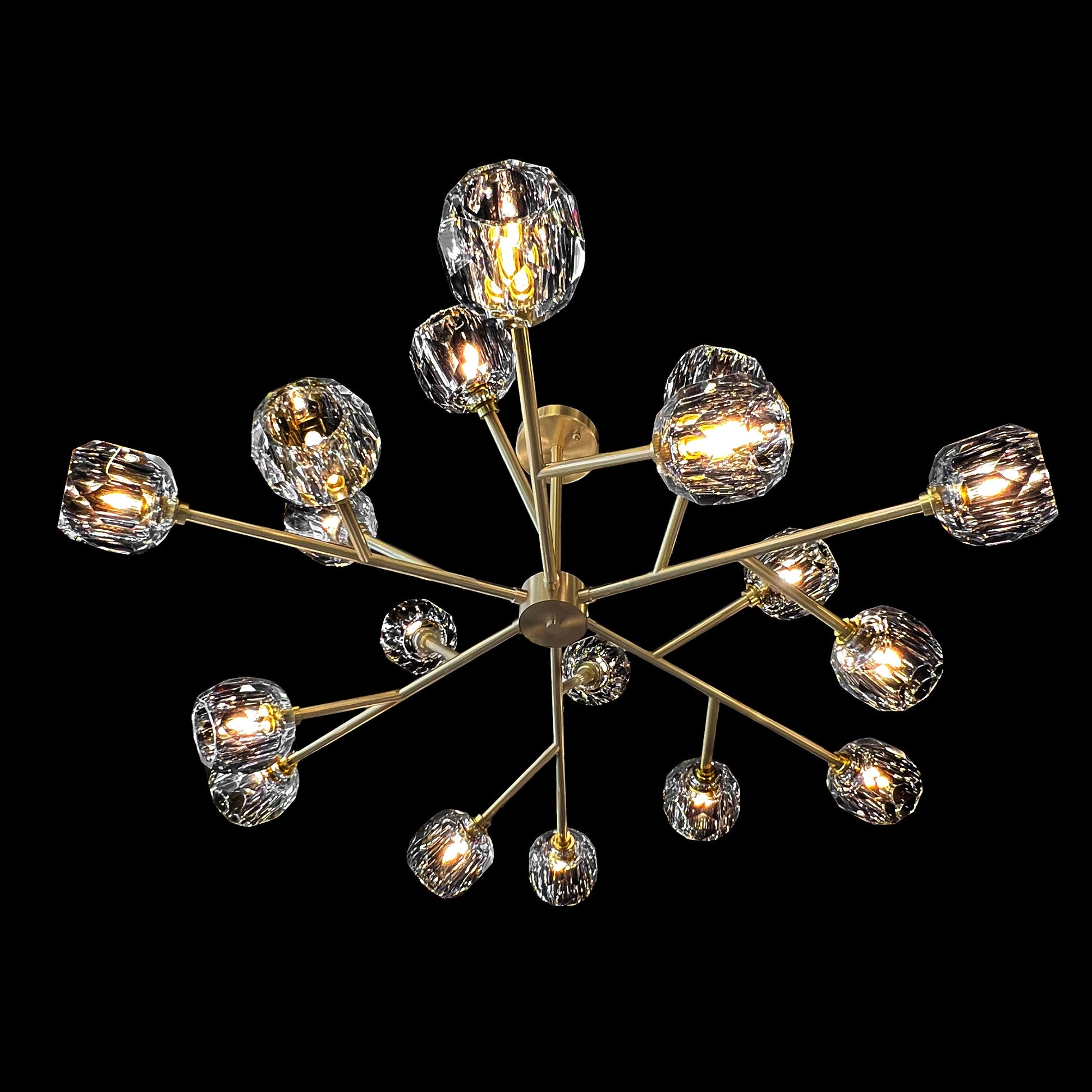  modern brass crystal chandelier on black background