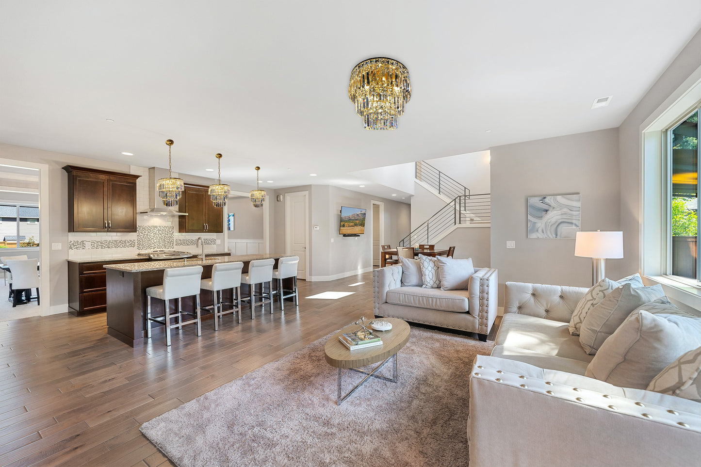 3- tier gold crystal chandelier lighting in open modern living space