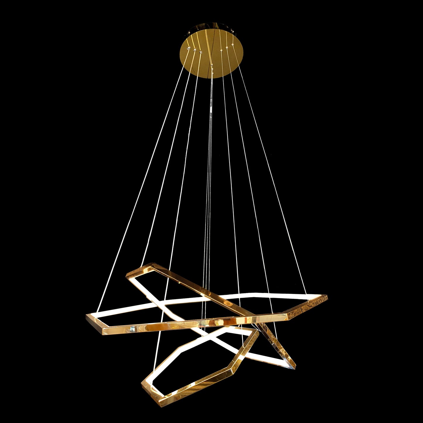 Gold chandelier with geometric design on a black background
